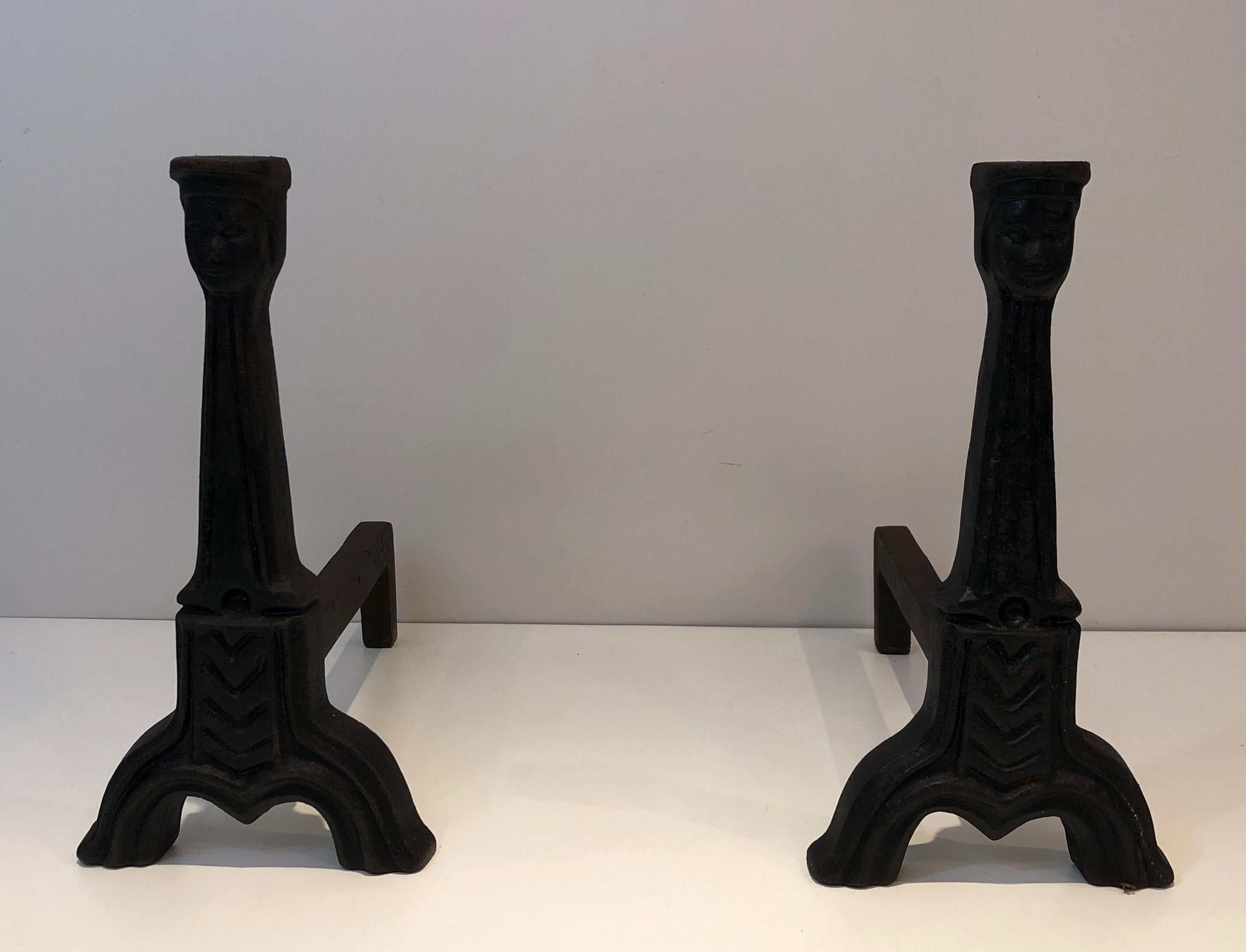 This pair of gothic style andirons is made of cast iron and wrought iron. This is a French work, circa 1950.