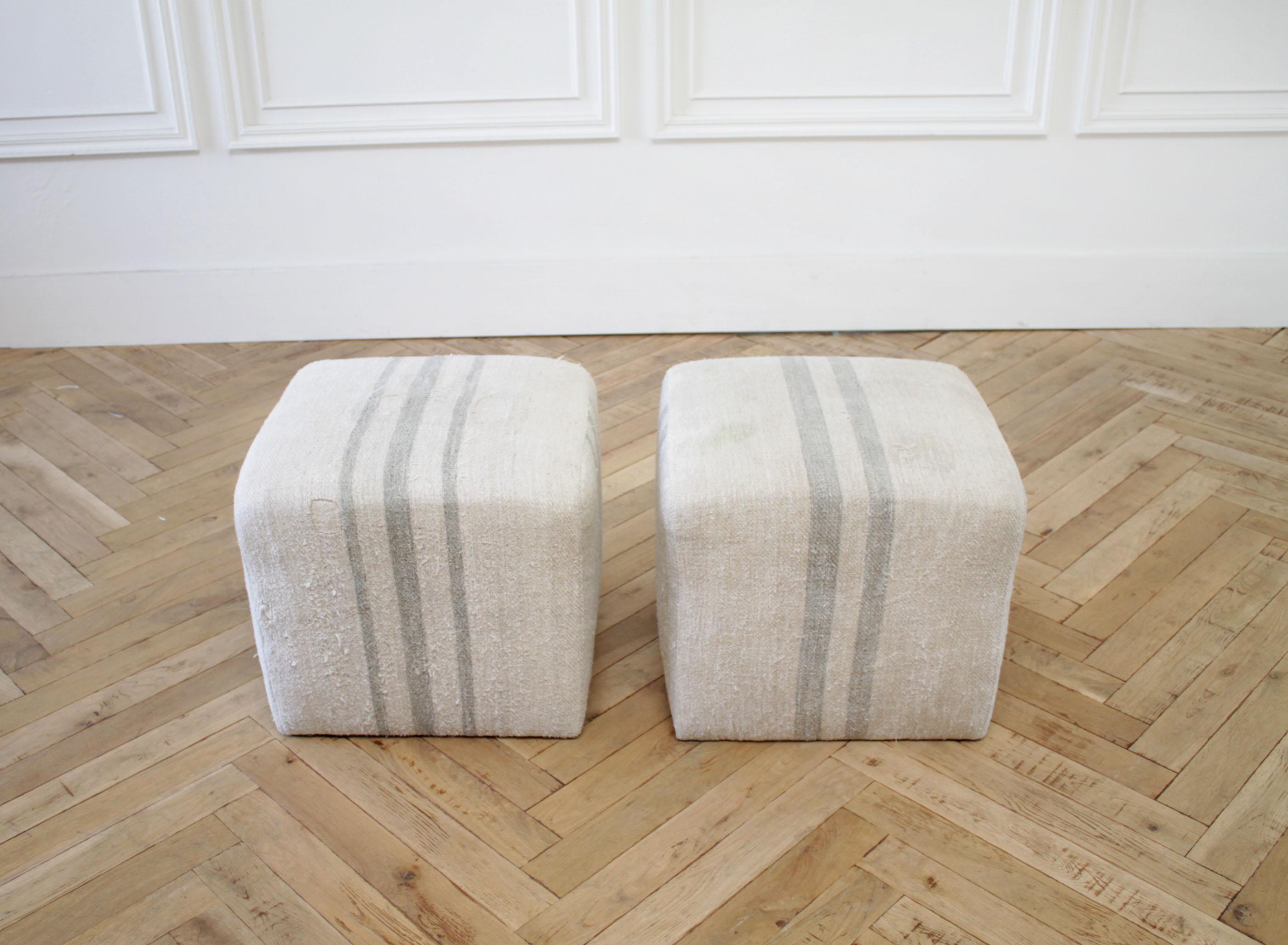 Pair of grainsack cube ottoman oatmeal color with light seaglass stripe
These have been made with vintage textiles, that may have some discolorations, original patchwork, and or original seams. These antique grain bags were used by farmers to hold