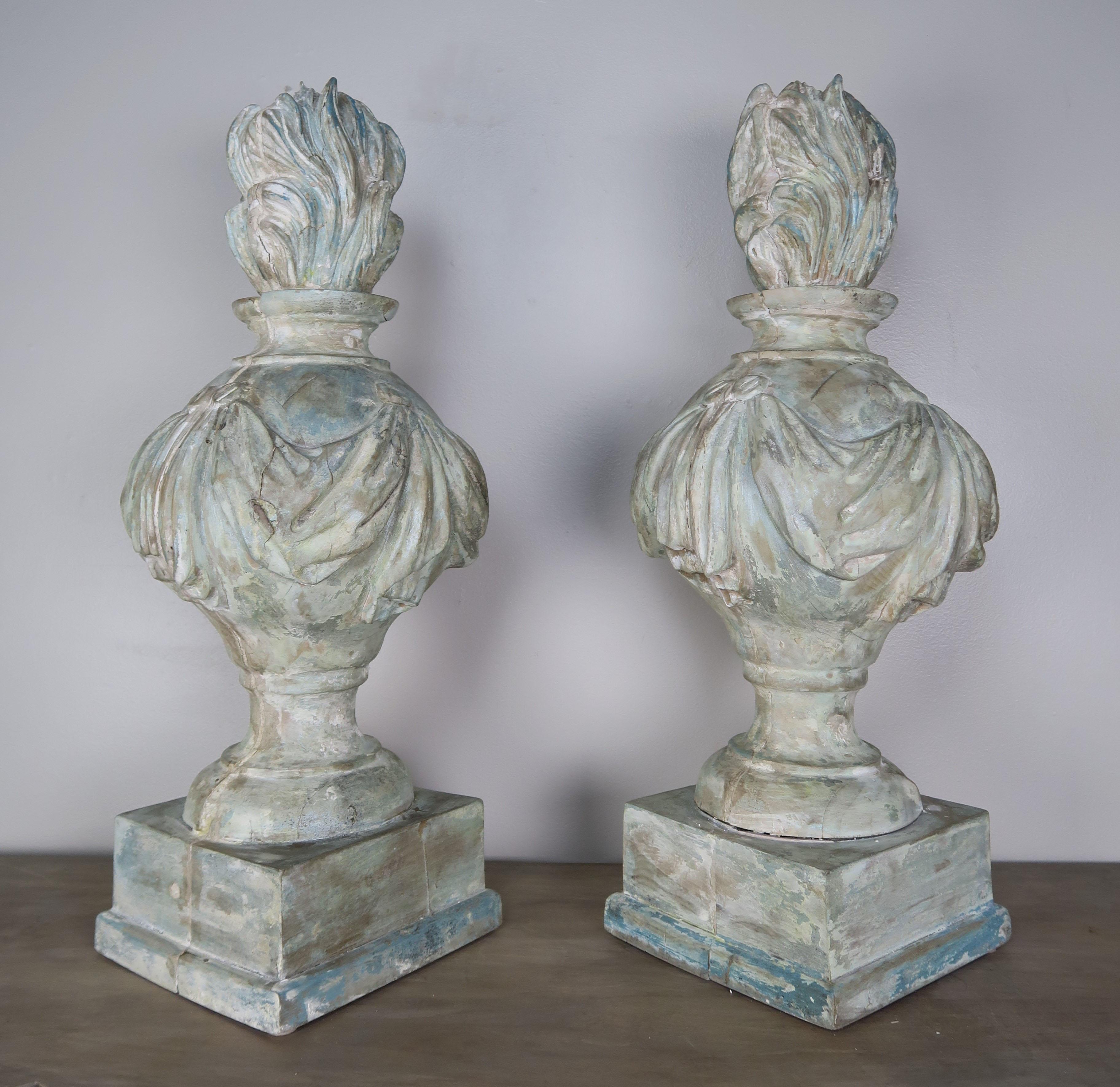 Pair of 19th century carved wood painted flamed finials. They are perfect for lamps as well but we are selling the pair as decor.