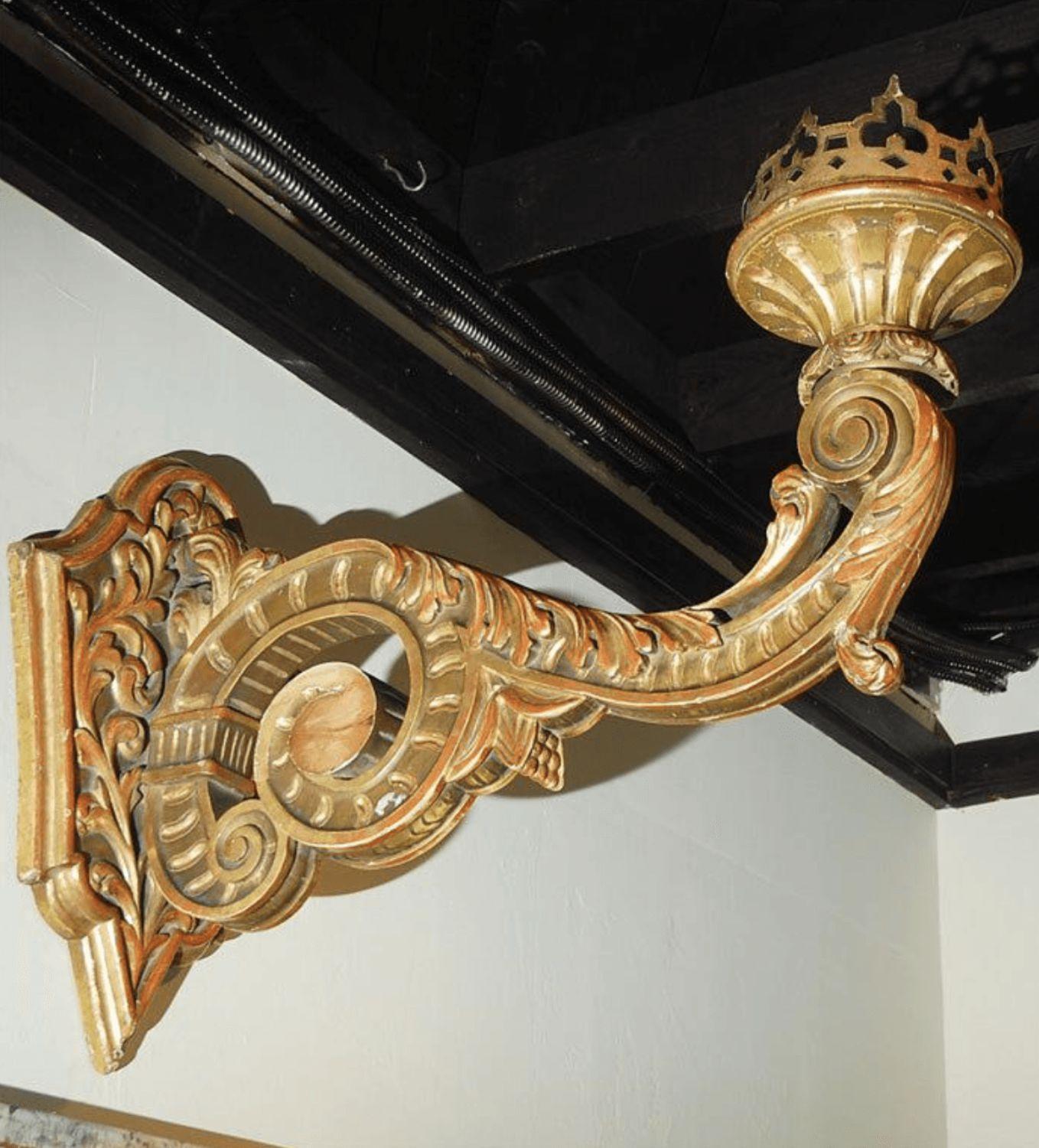Pair of massive hand-carved gilt wood sconces.