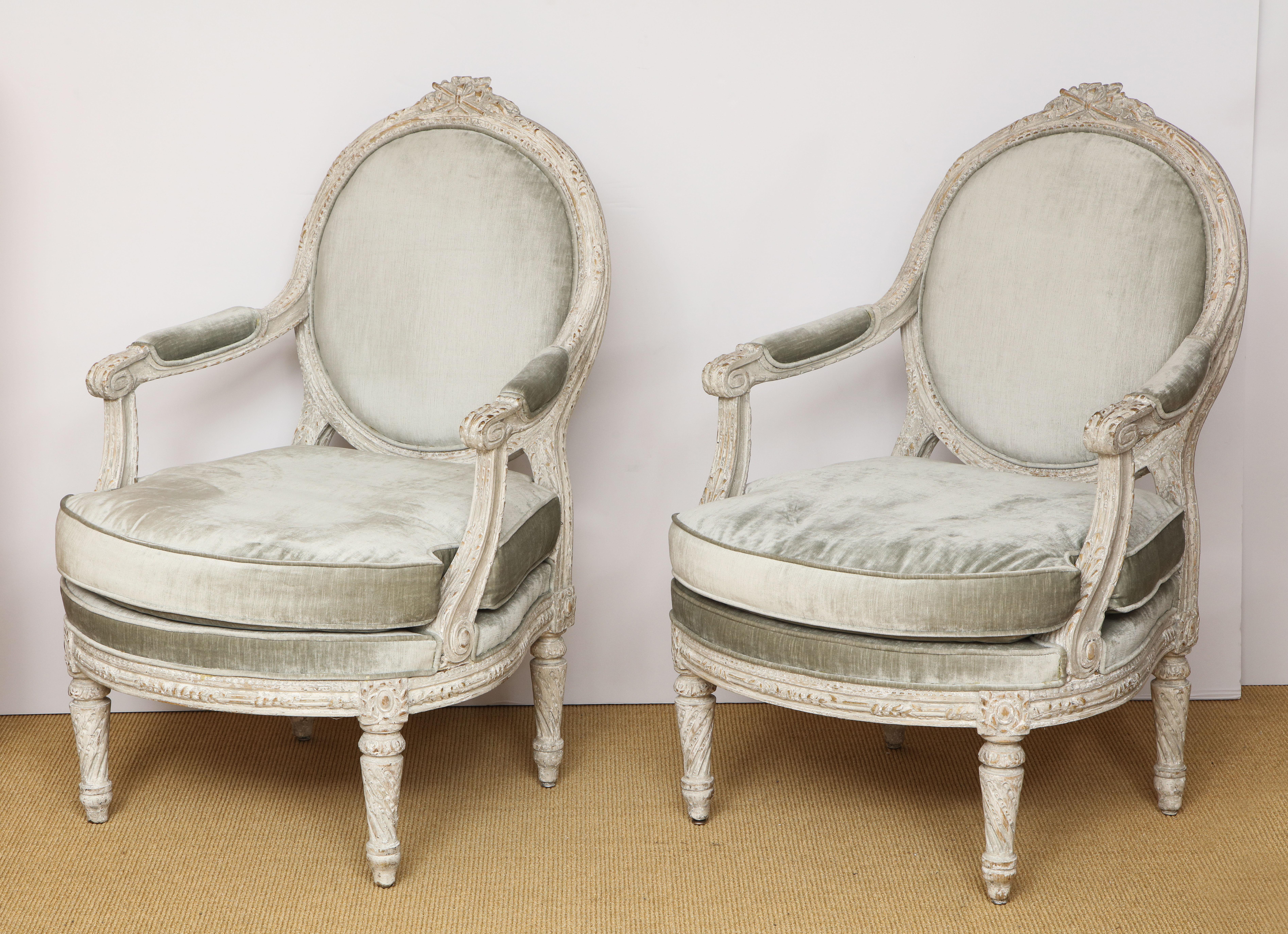 The pair of chairs from the Piedmont region of Italy. Having a rounded back with a carved floral crest, the frame carved with wheat and the legs having a twisted fluting.

Paint refreshed at a later date.