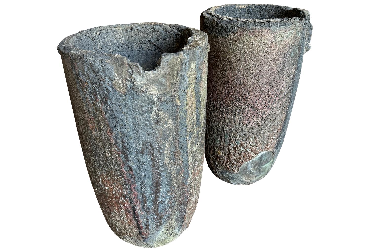 A wonderful pair of early 20th century French Creusets - Foundry Pots. Fabulous as Jardinieres or planters. Perfect for any interior or garden. A crucible was made from a material with a much higher melting point than what was going to be melted in