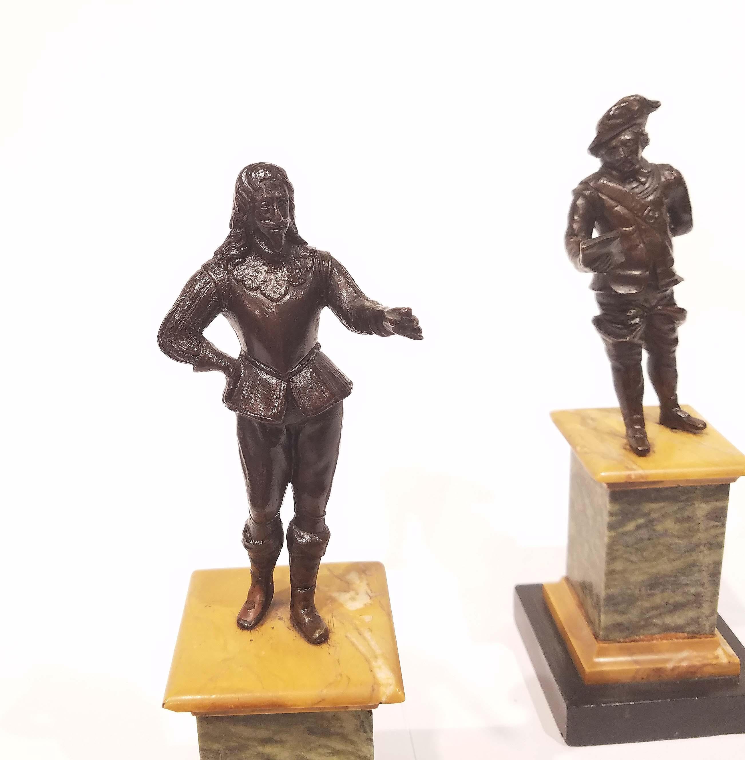 Solid cast bronze with rich black, brown patina mounted on marble bases, circa mid-19th century. Measures about 10