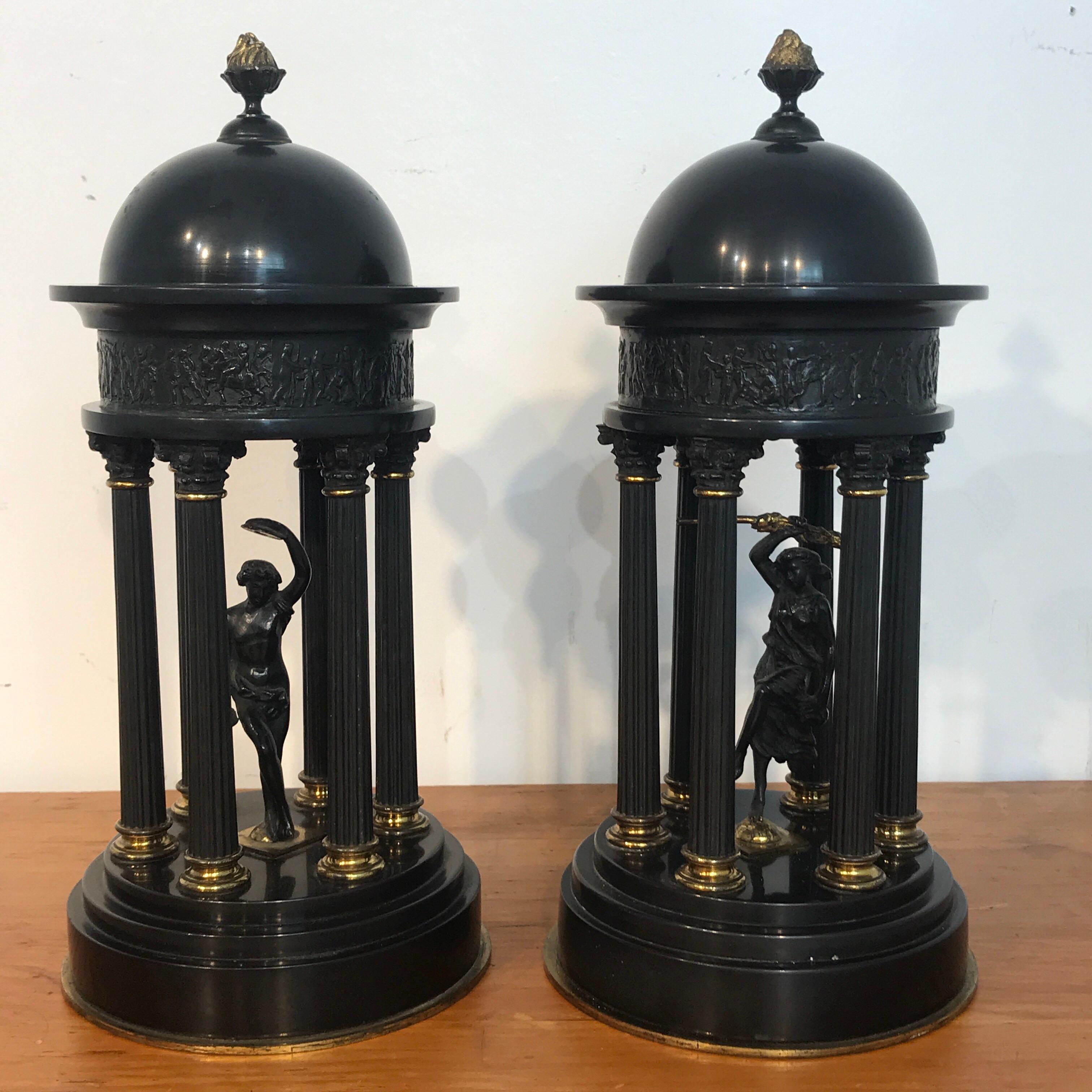 Pair of Grand Tour bronze and marble models of Tempiettos, each one with patinated and gilt bronze columns with a central classical deity figure, the domes and bases are made of specimen quality Belgian black marble.