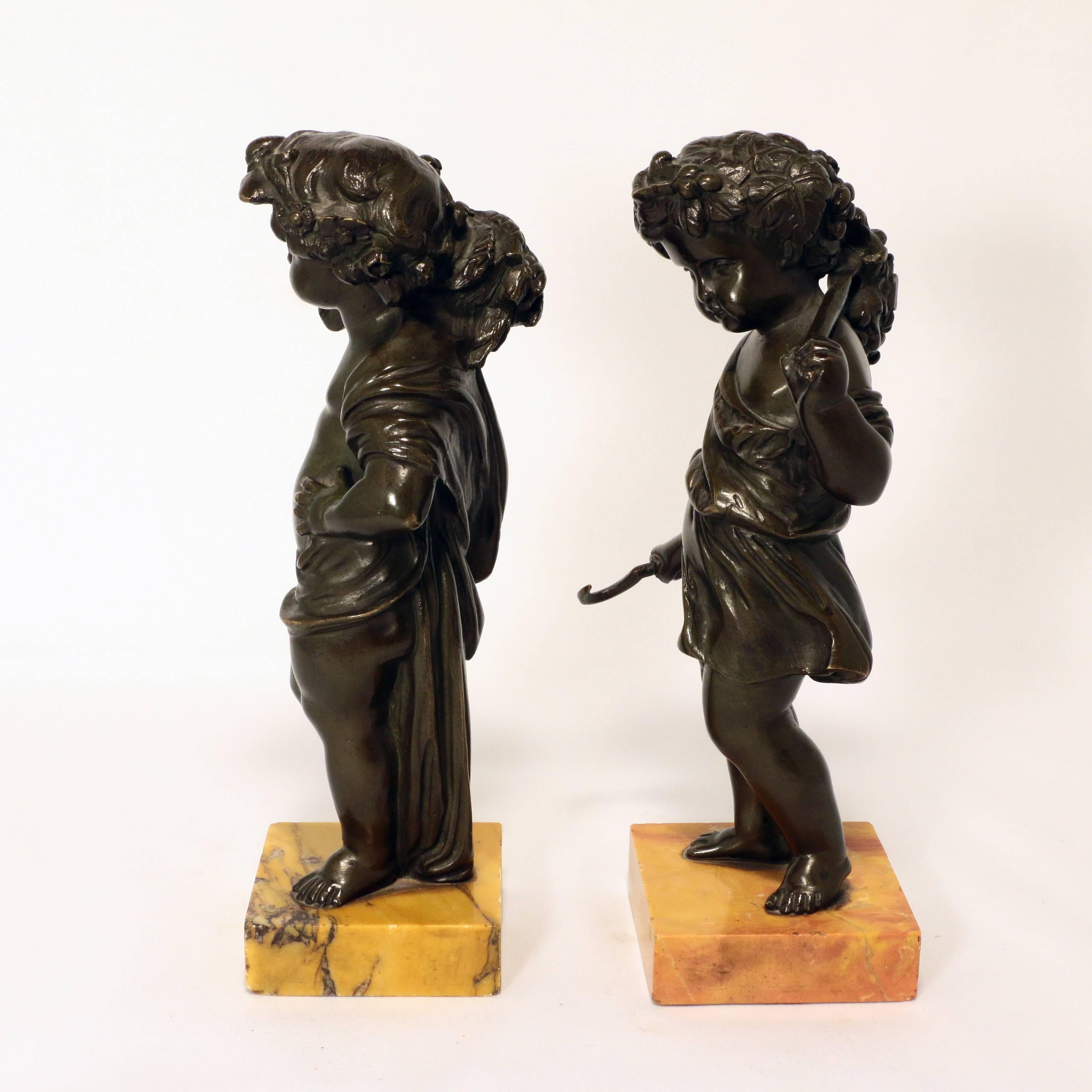 This charming young couple evoke summer in Italy. She with a bill hook and branch with fruiting vine, and her companion with a sheaf of wheat over his shoulder. Each is well modelled and stands on a square Siena marble base.