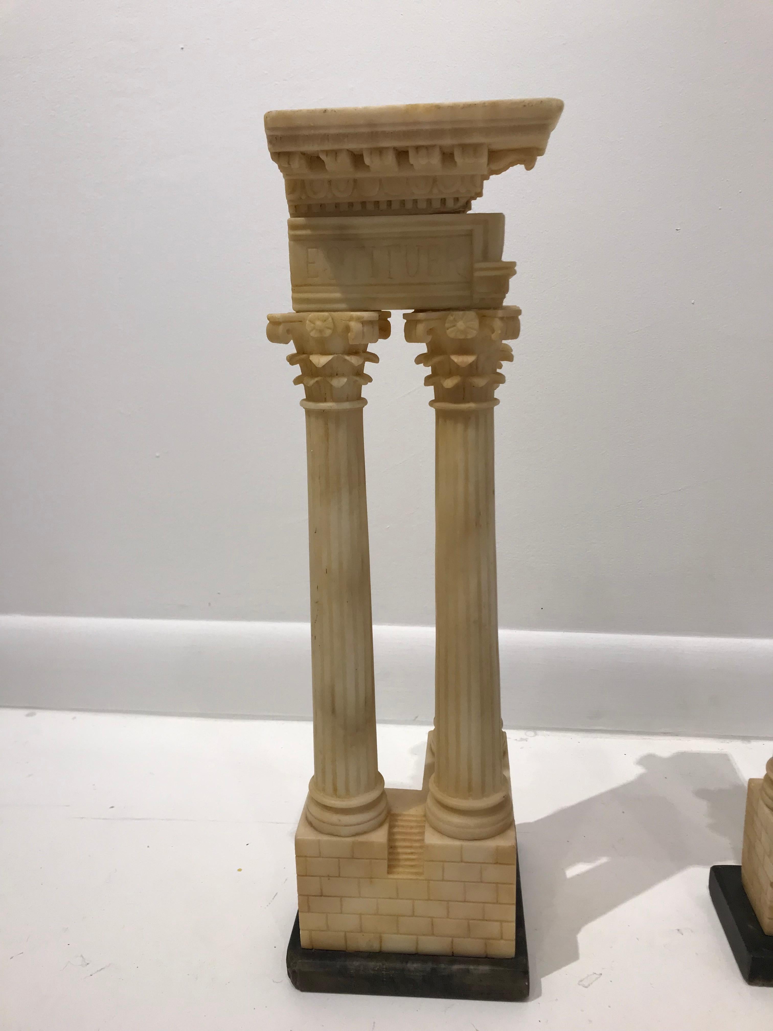 19th century carved alabaster pair of Grand Tour Models of Roman columns. These are models of the Temple of Vespasian & Titus and caster & Pollux Italy, circa 1880.