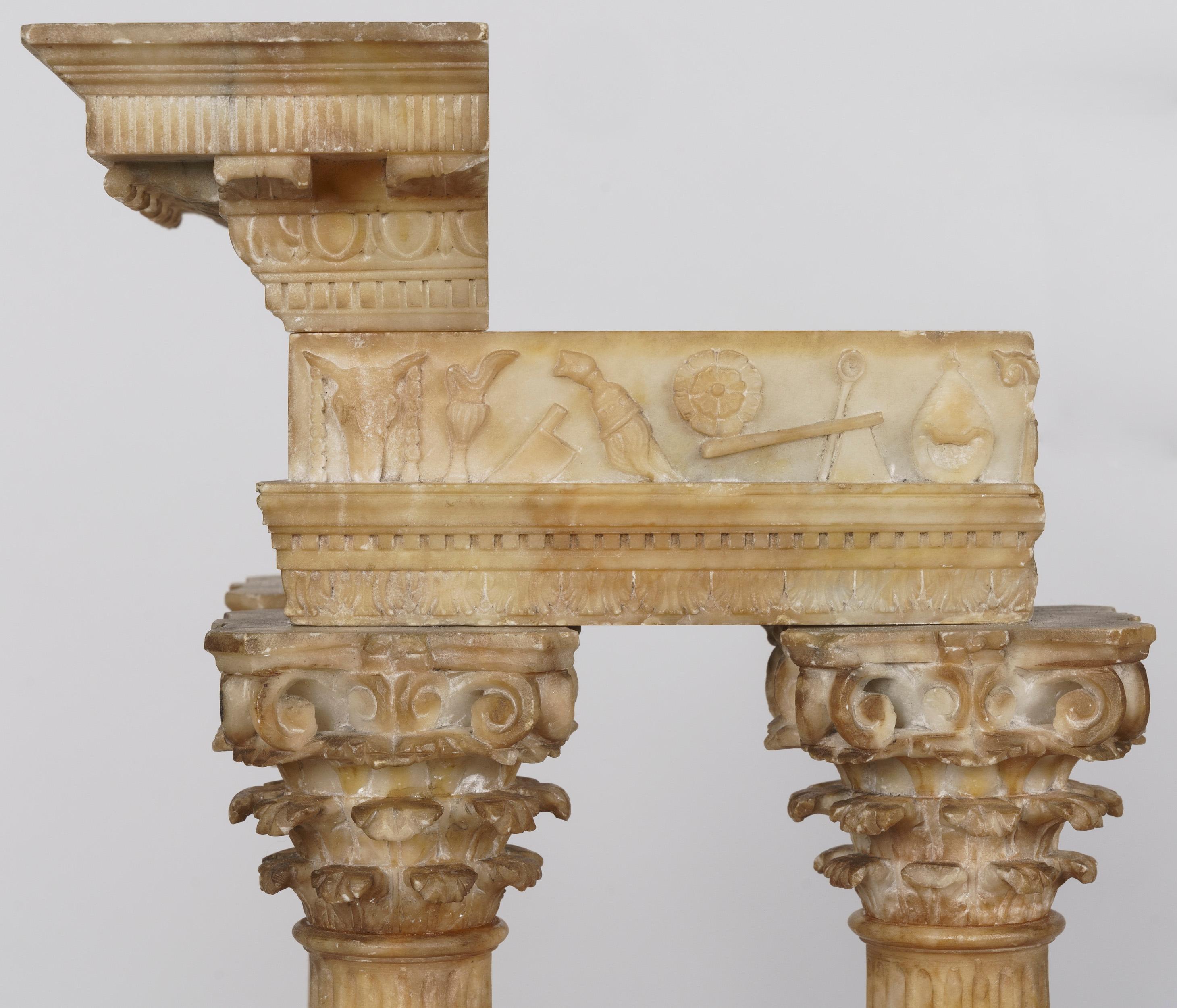 An Impressive Pair of 'Grand Tour' Models Of the Temples of Vespasian and Castor & Pollux 

Carved from alabaster and supported on grey marble bases, the models representing the ruins of the two temples located in the Roman Forum, their Corinthian