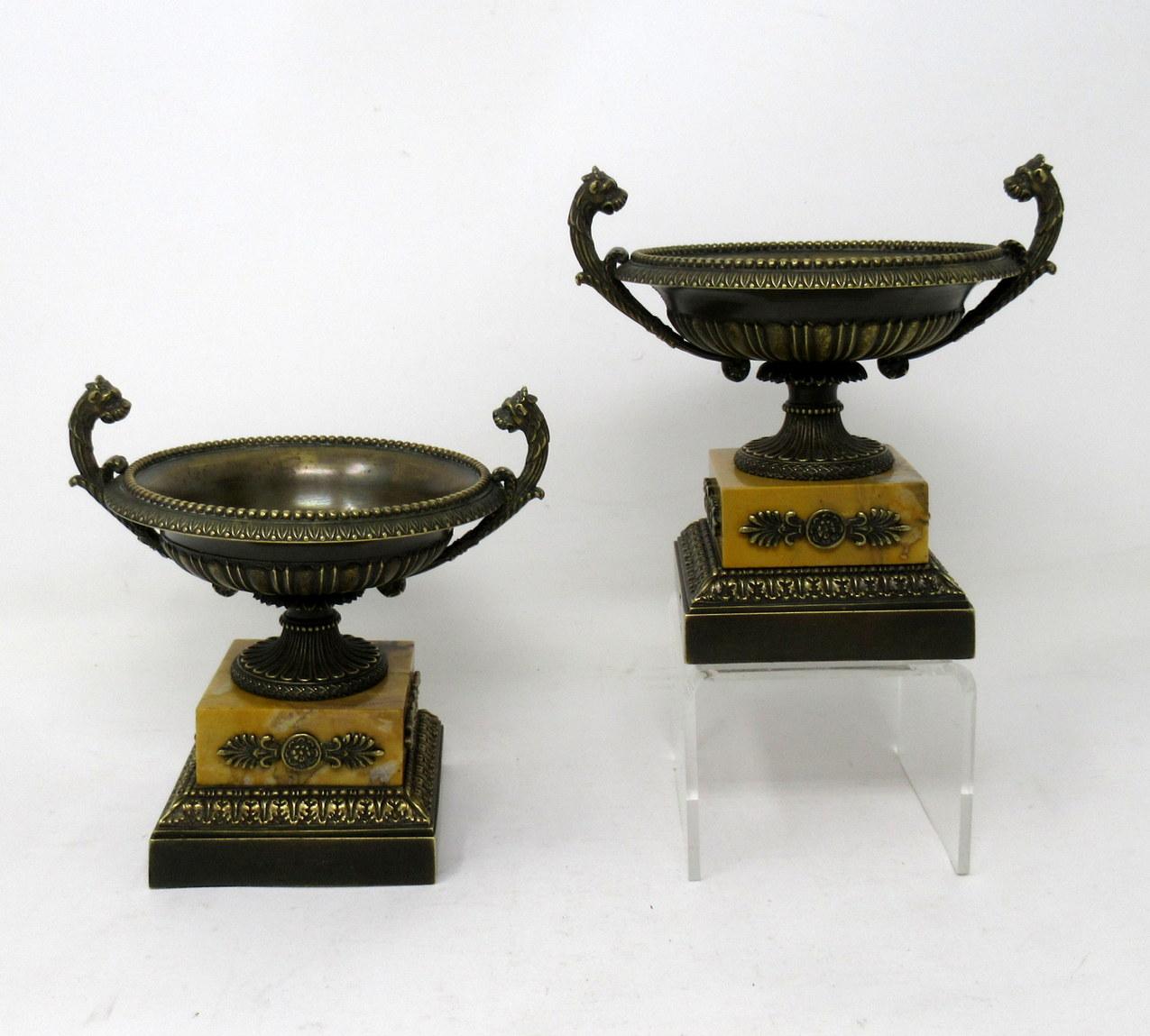 A very fine pair of French patinated bronze and well grained Sienna marble grand tour twin handle tazza of compact proportions, first quarter of the 19th century.

Each circular bowl with lobed reeded body and decorative moulded thumb detail rims