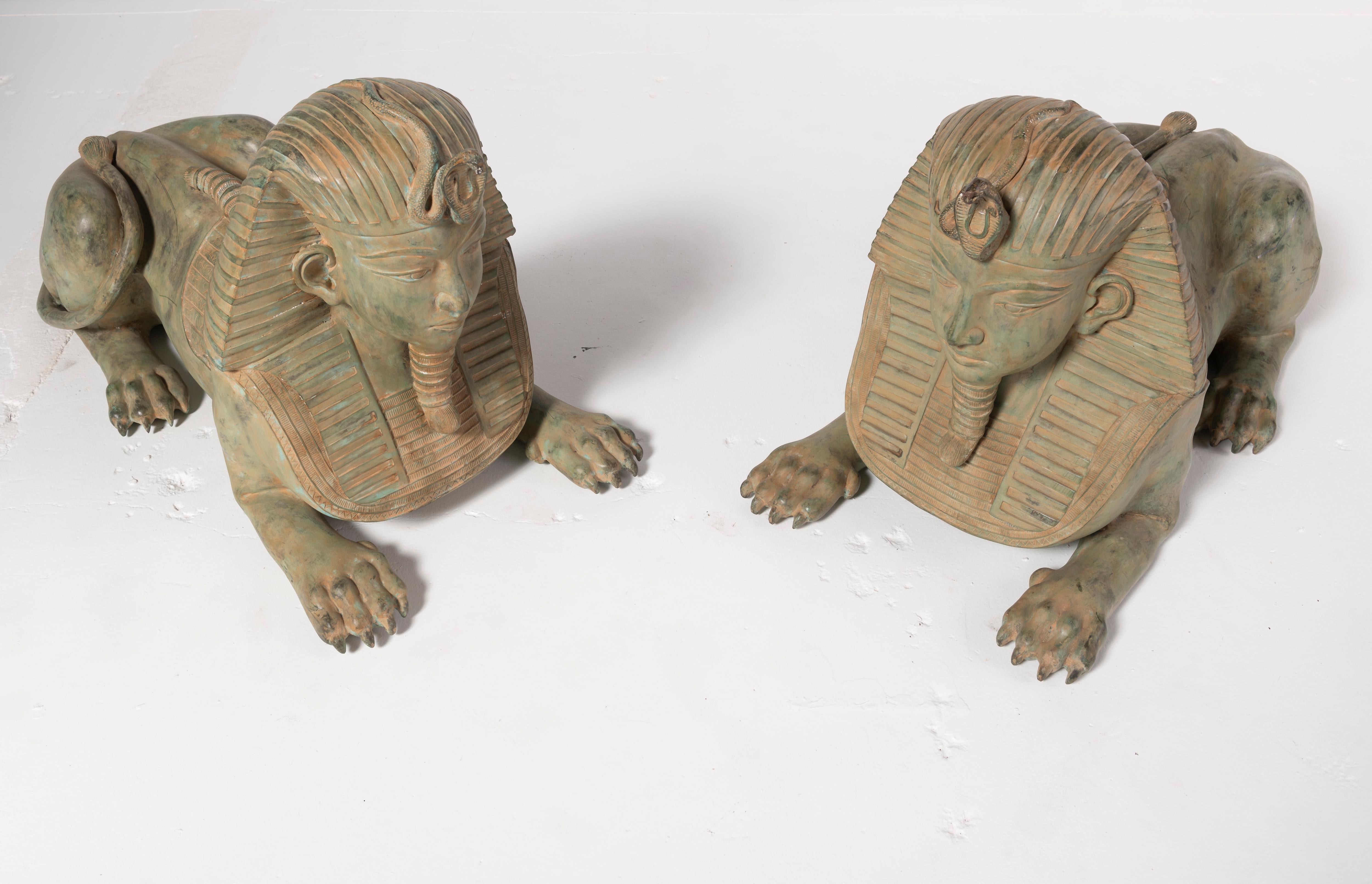20th Century  Pair of Grand Tour Style Large Patinated Figures of Seated Sphinxes For Sale