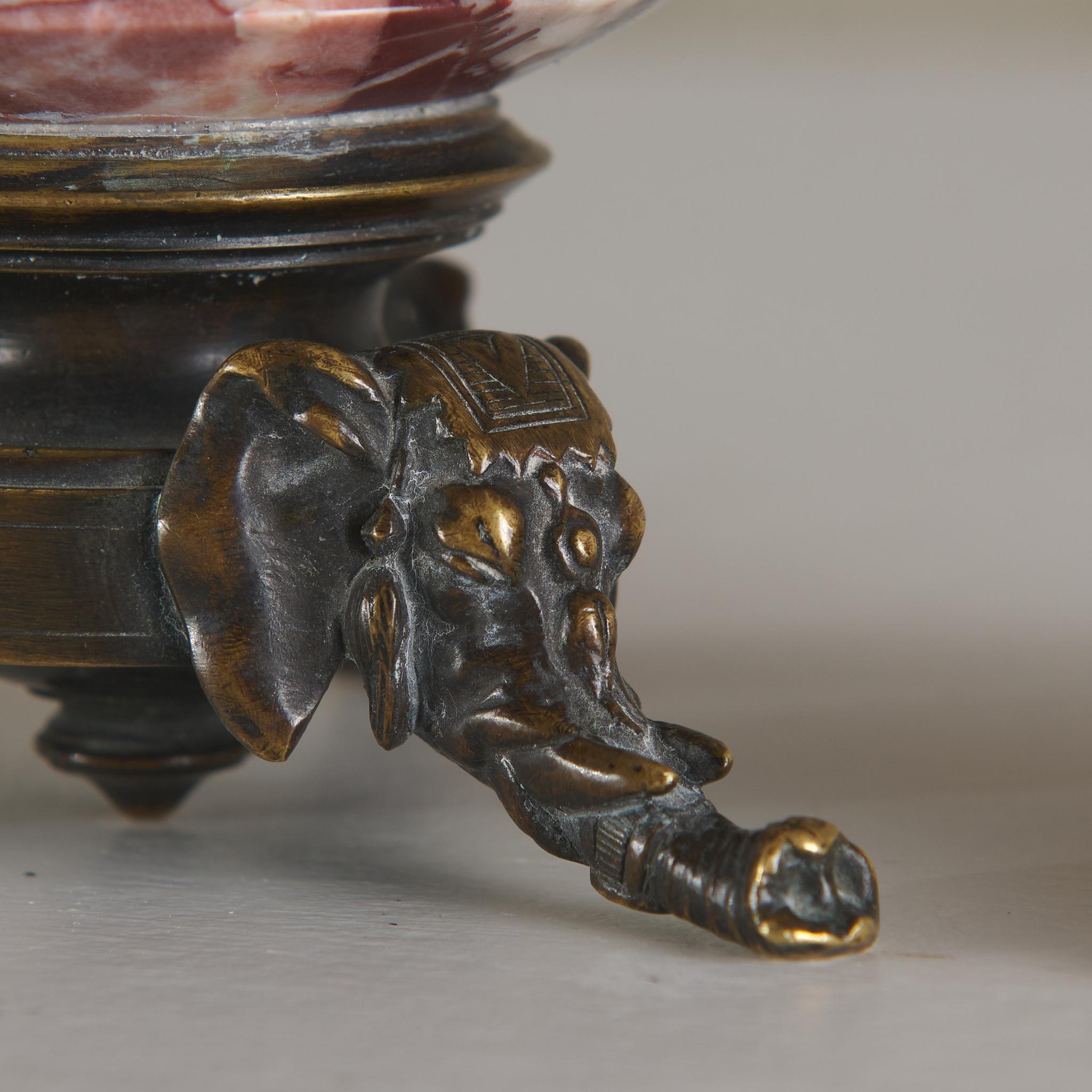 Carved Pair of Grand Tour Urns with Elephant Tripod Bases
