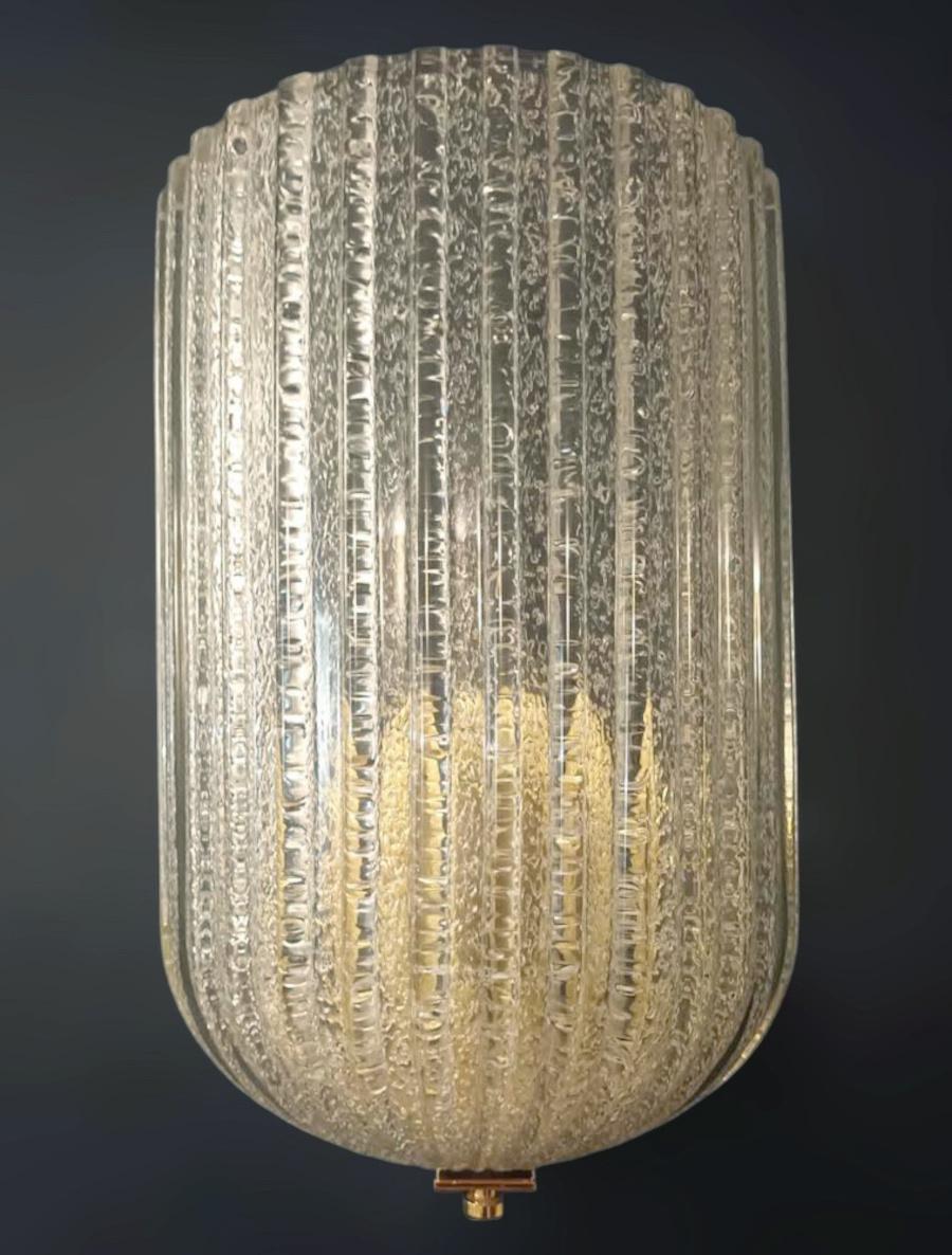 Italian wall light with a Murano glass shield hand blown in Graniglia technique to produce granular textured effect / Made in Italy by Barovier e Toso, 1960s
Original label on frame
Measures: Height 12.5 inches, width 8 inches, depth 4.5 inches
1