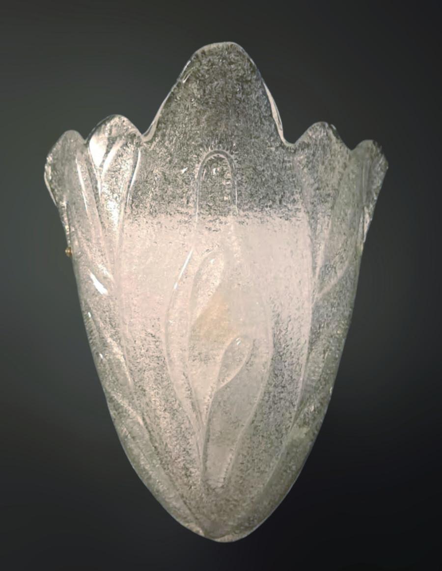 Italian wall light with a Murano glass shield hand blown in Graniglia technique to produce granular textured effect, mounted on white metal frame / Made in Italy 1980s, in the style of Barovier e Toso
Measures: Height 11.5 inches, width 10 inches,