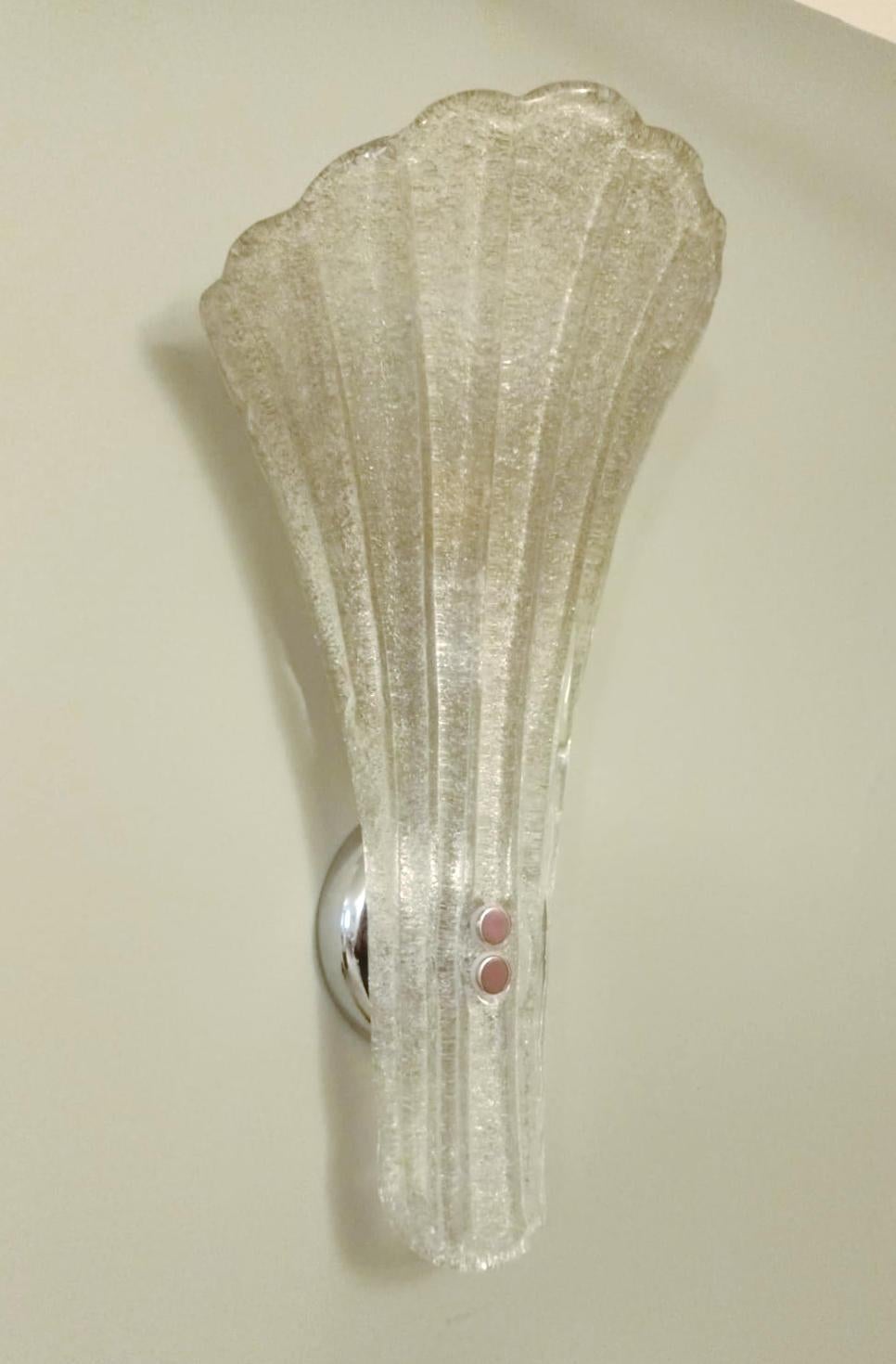 Vintage Italian wall lights with trumpet shaped clear Murano glass shades hand blown with smoky granular using Graniglia technique, mounted on chrome finish frames / made in Italy circa 1960s
Measures: height 18 inches, width 9 inches, depth 7