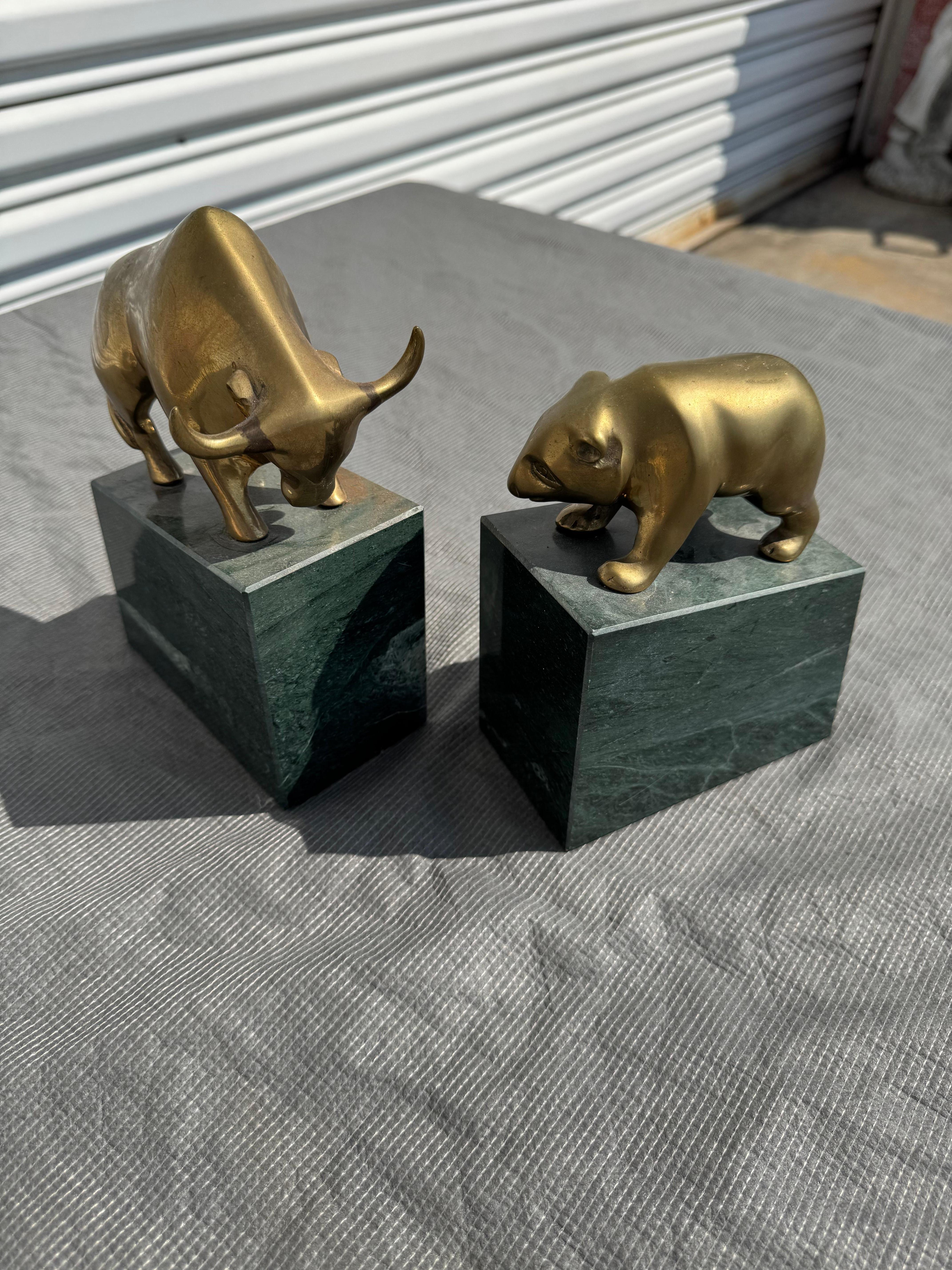These bookends depict a Bull and a Bear on the top of the Granite..
They would be great for any office or library.
The bull and bear are made of solid brass.