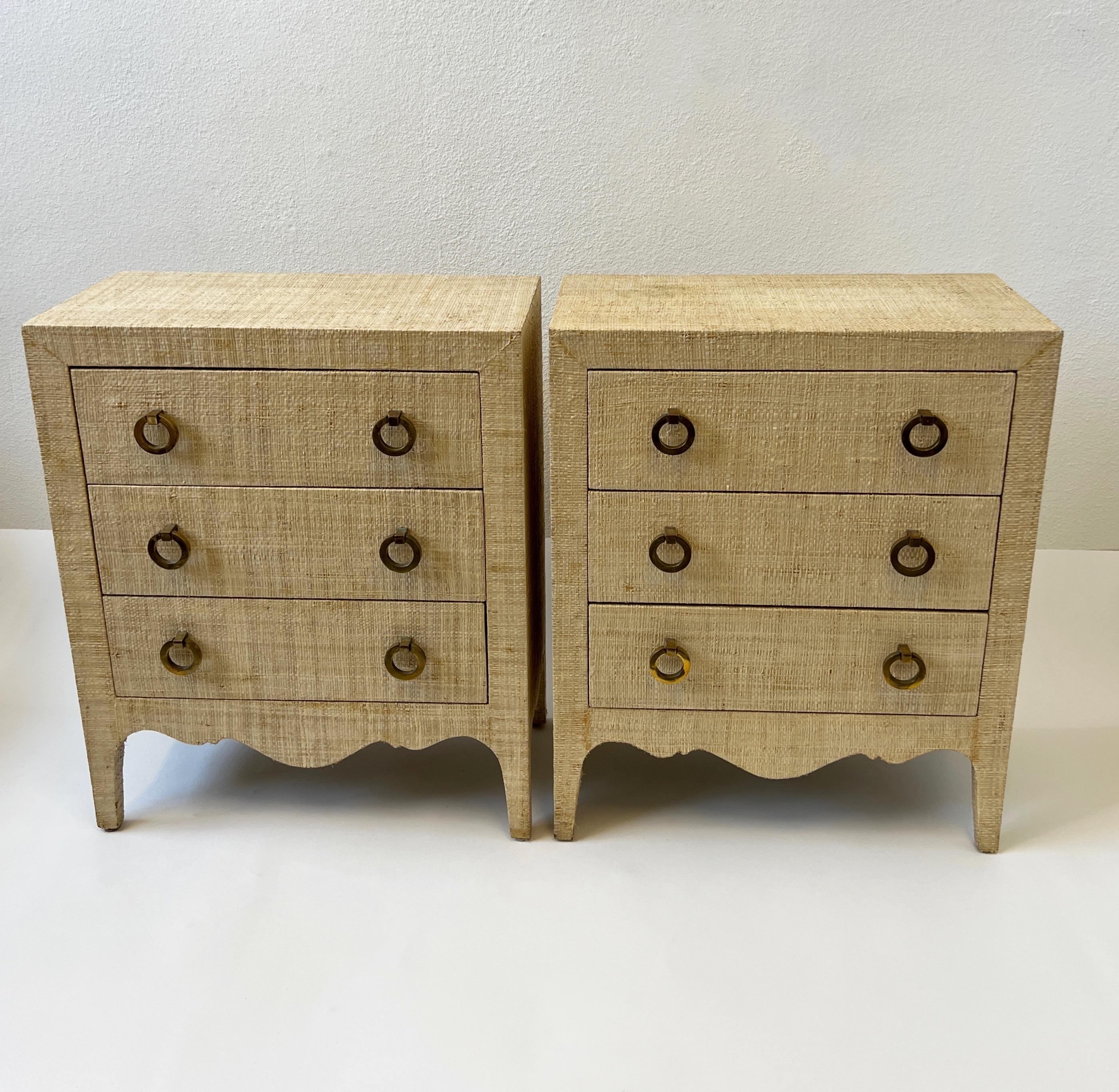 Pair of 1980’s grasscloth and brass night stands in the style of Harrison Van Horn. 
Constructed of solid wood covered with natural grasscloth and solid brass pulls. 
They show some wear consistent with age and use. 

Measurements: 13” Deep,