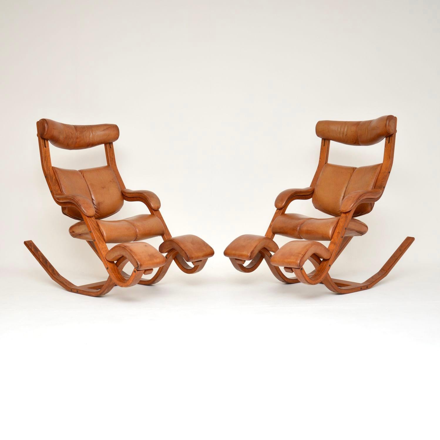 An amazing pair of reclining leather armchairs made by Stokke in Norway. They were designed by Peter Opsvik, this model is called the ‘Gravity Balans’. These date from around the 1980’s.

They are of superb quality, and the design is exceptional.