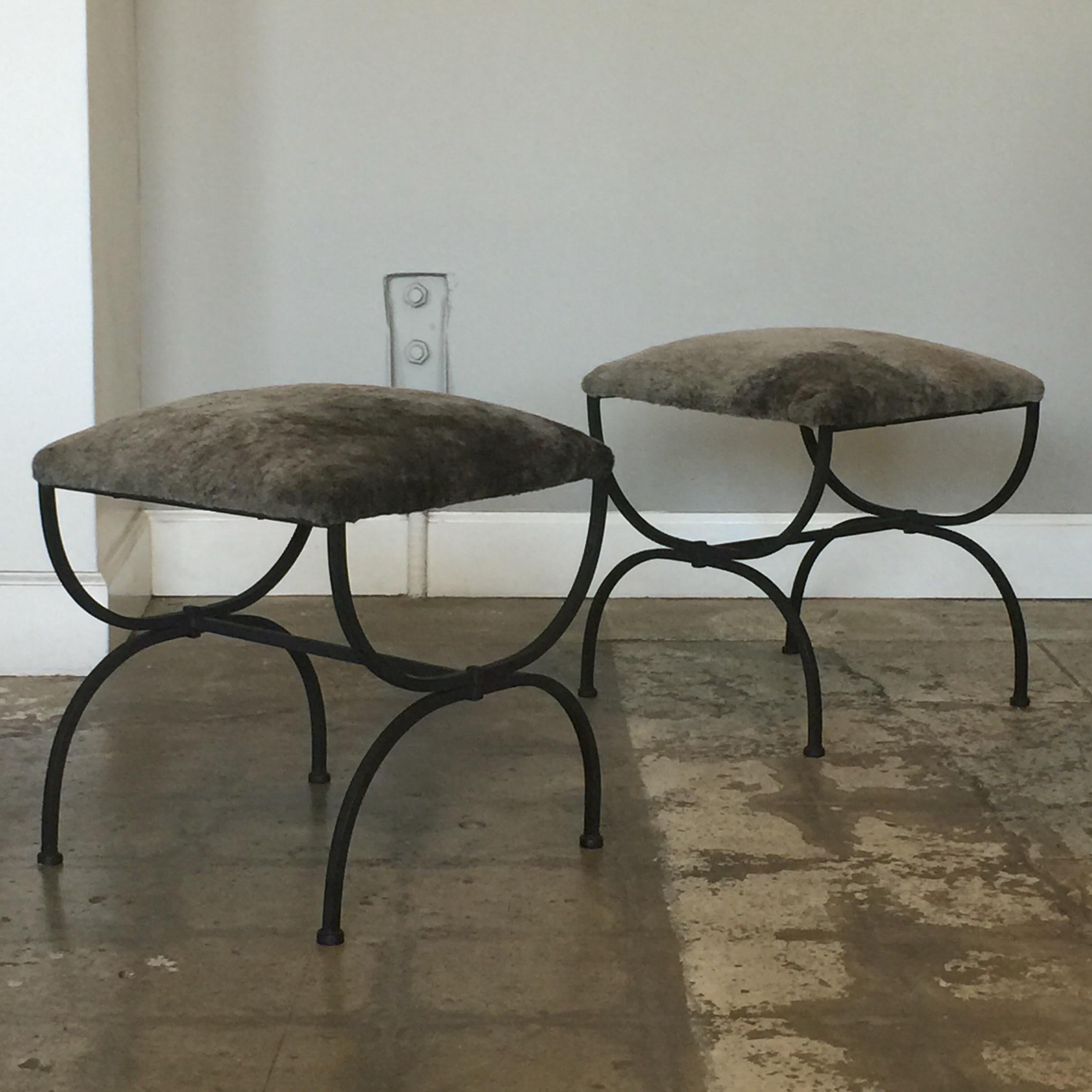 Pair of chic gray shearling 'Strapontin' stools by Design Frères. Matte black steel base with grey shearling upholstered seats.