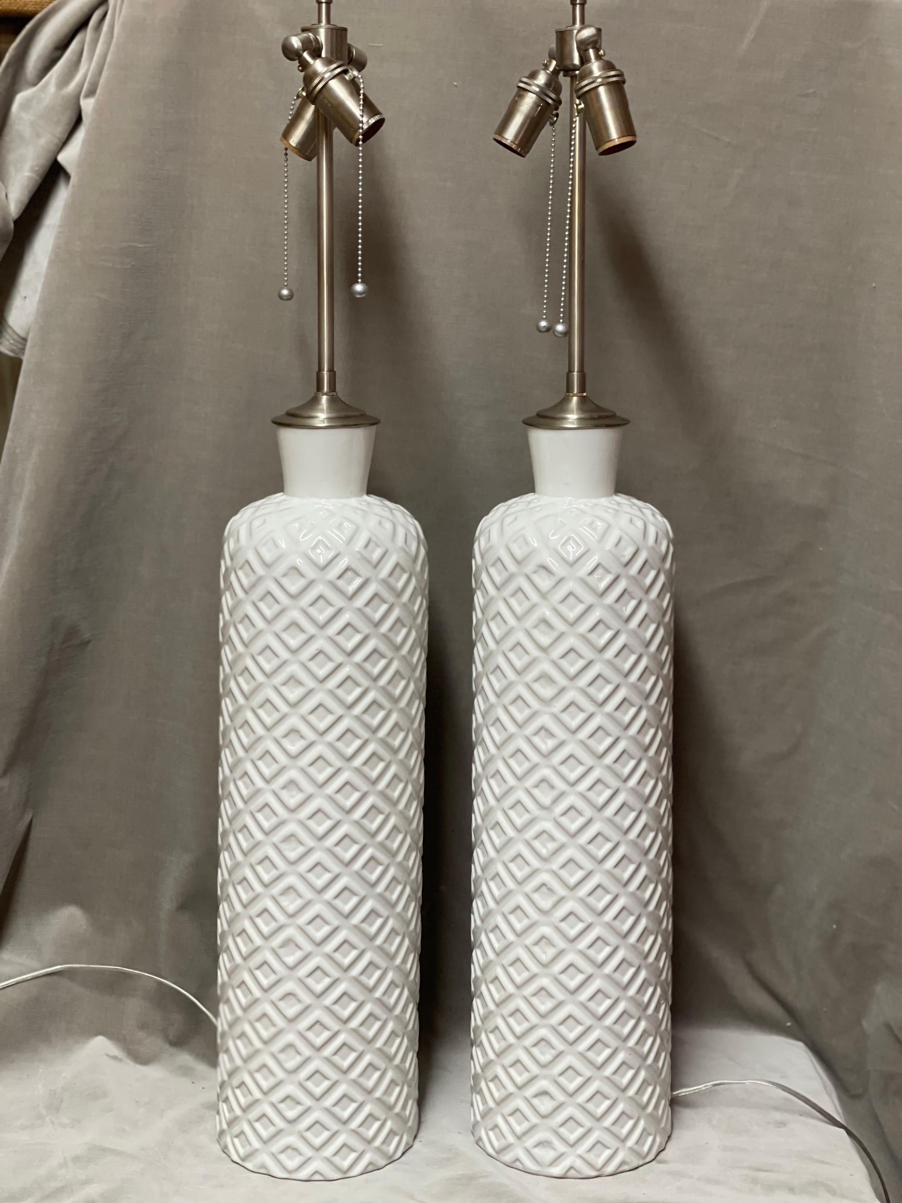 Pair of Great Tall Chic Embossed Ceramic White Vessels with Lamp Application In Excellent Condition For Sale In Bronx, NY