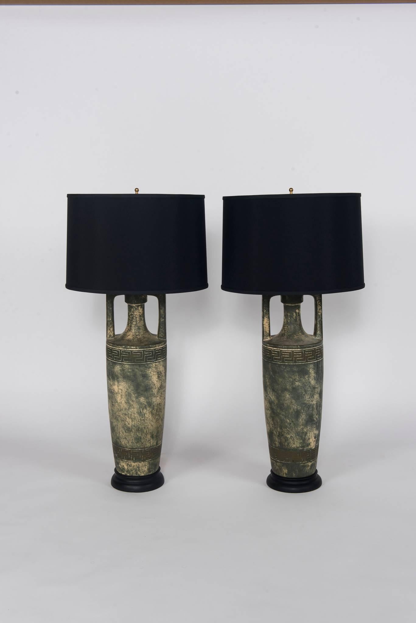 Pair of Greek key stoneware lamps with black shades.