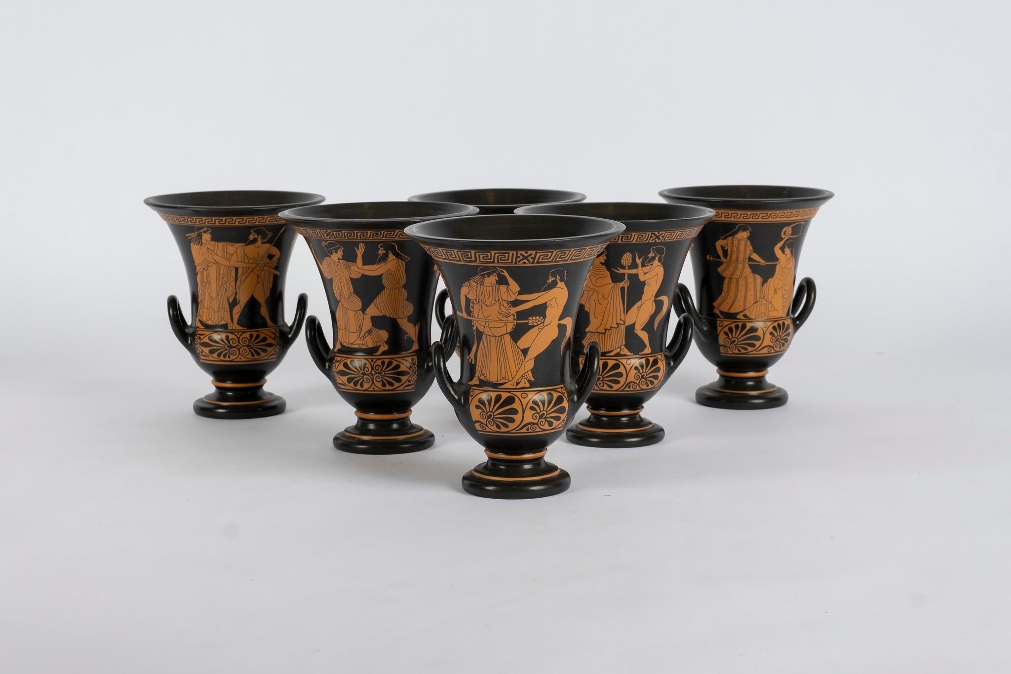 Mid 20th century Attica terra cotta kalyx-kraters featuring gods and goddesses in early Classical Greek scenes. These two handle bowls were made for mixing wine and water and named after the shape of the calyx on a flower. Sold by the pair.