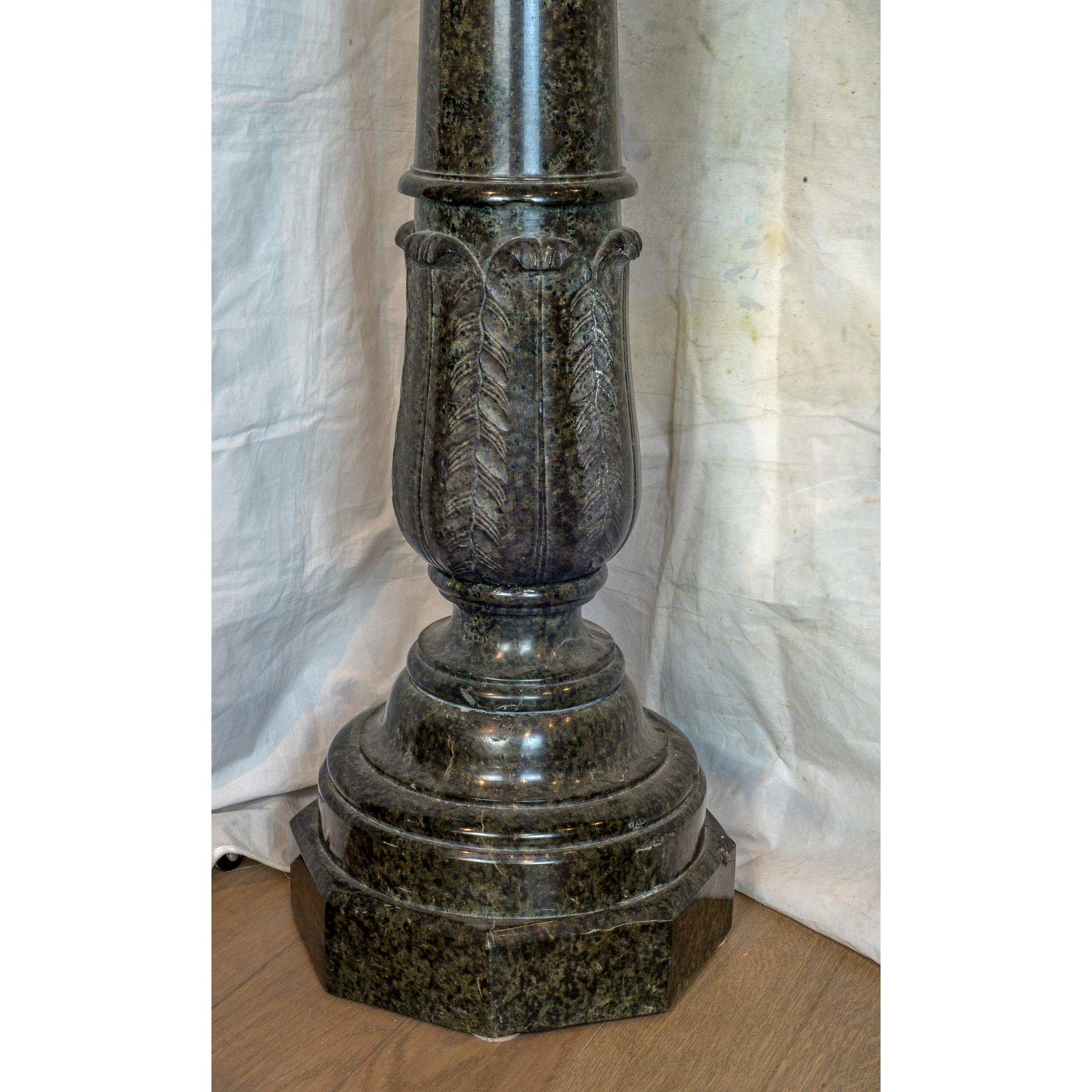 Each as a stylized lotus flower on a central baluster upright stem, on a carve and cylindrical base.

Date: 19th century
Origin: Continental
Dimension: 42 3/4 in. x 13 in.