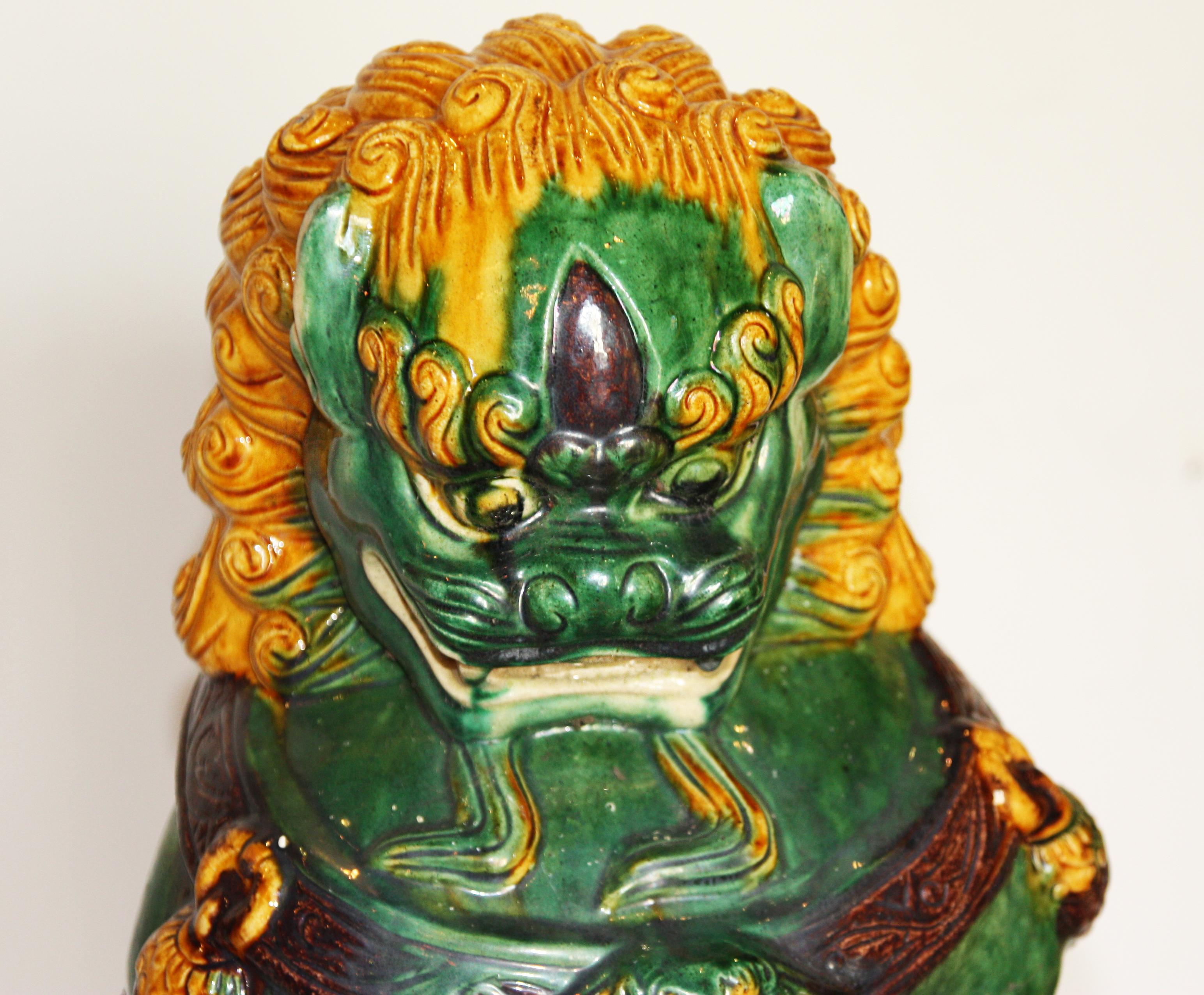 Chinese Export Pair of Green and Gold Chinese Sancai Glazed Foo Dogs