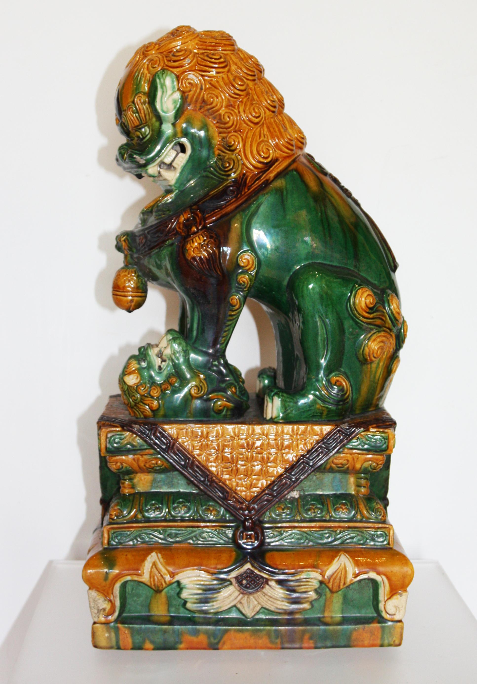 Pair of Green and Gold Chinese Sancai Glazed Foo Dogs In Good Condition In San Antonio, TX