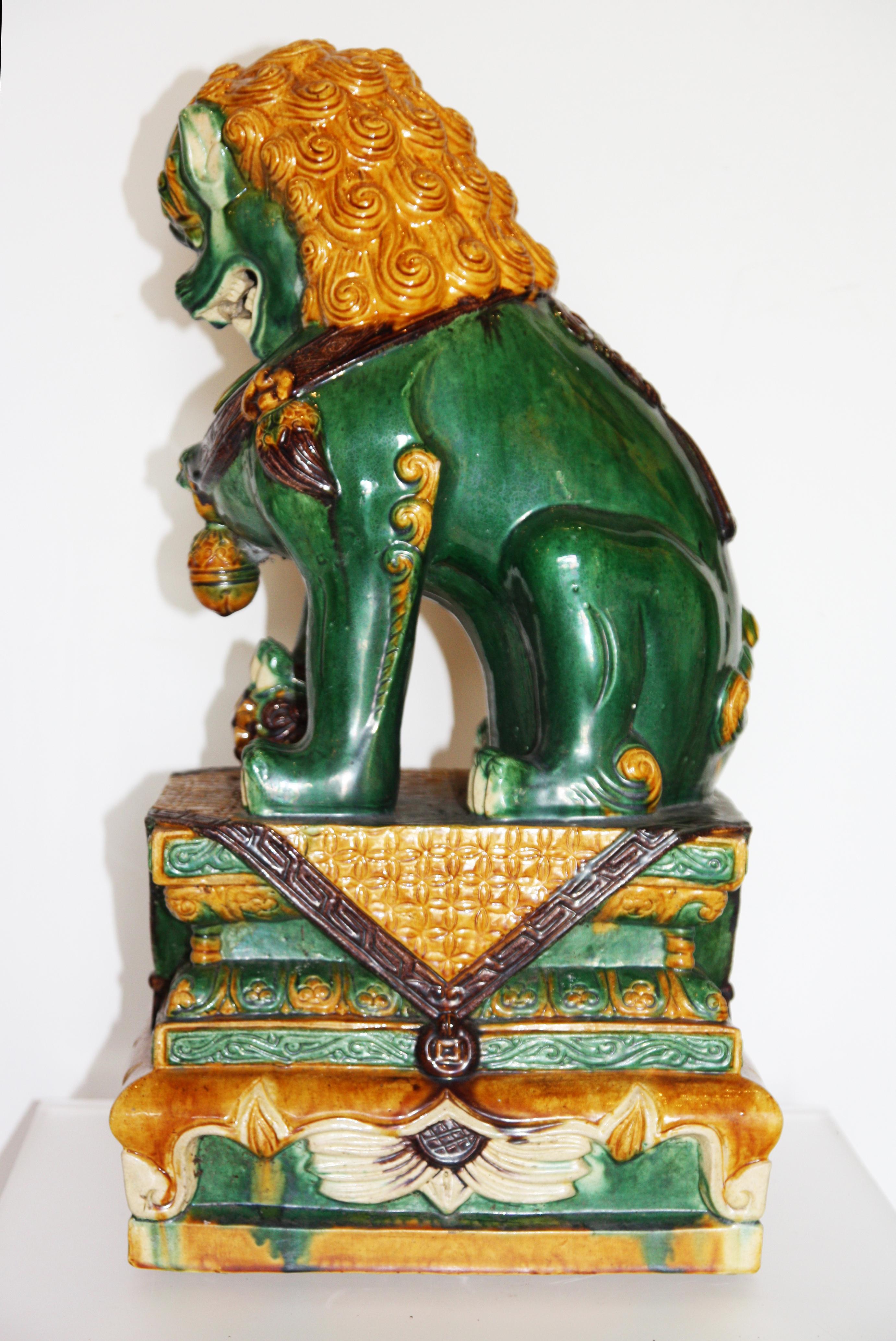 20th Century Pair of Green and Gold Chinese Sancai Glazed Foo Dogs