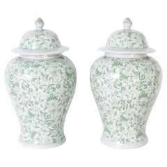 Pair of Green and White Lidded Urns or Jars