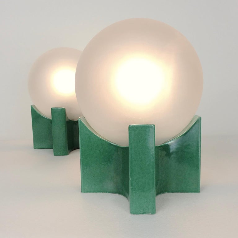 Nice pair of table lamps, circa 1960, Italy.
Green ceramic and frosted glass globe.
Dimensions: 18 cm H, 13 cm W, 13 cm D.
All purchases are covered by our Buyer Protection Guarantee.
This item can be returned within 7 days of delivery.


 