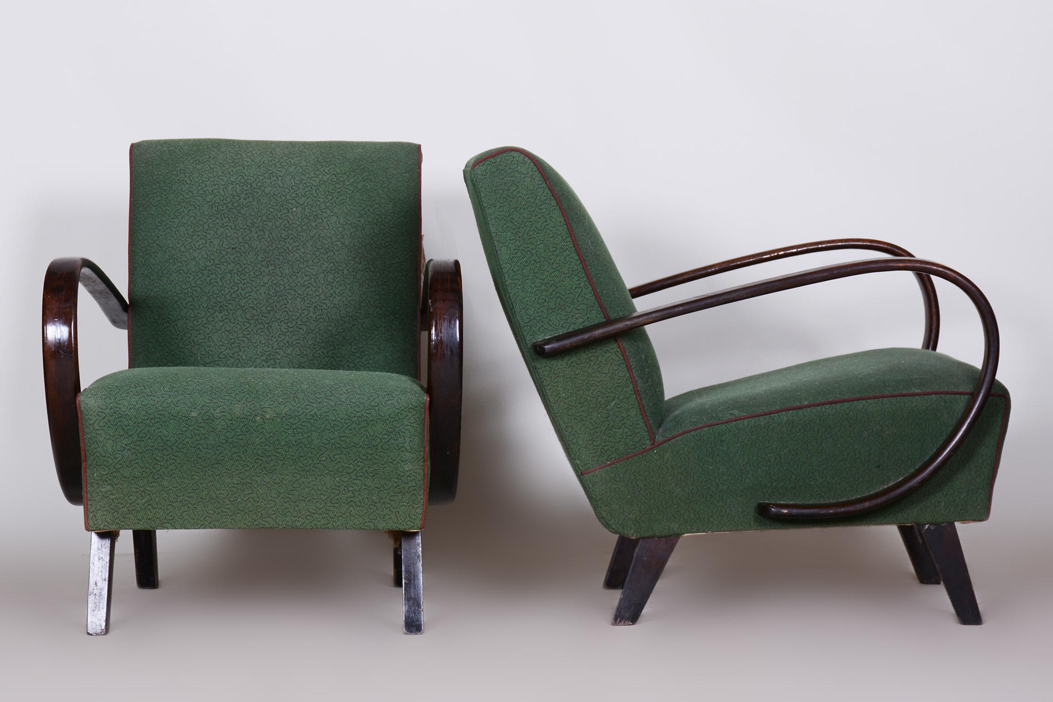 Pair of green Czech Art Deco beech armchairs, Jindrich Halabala.

Source: Czechia 
Period: 1930-1939
Architect: Jindrich Halabala 
Maker: UP Zavody Maker
Material: Beech, fabric

Original preserved upholstery.
The fabric has been