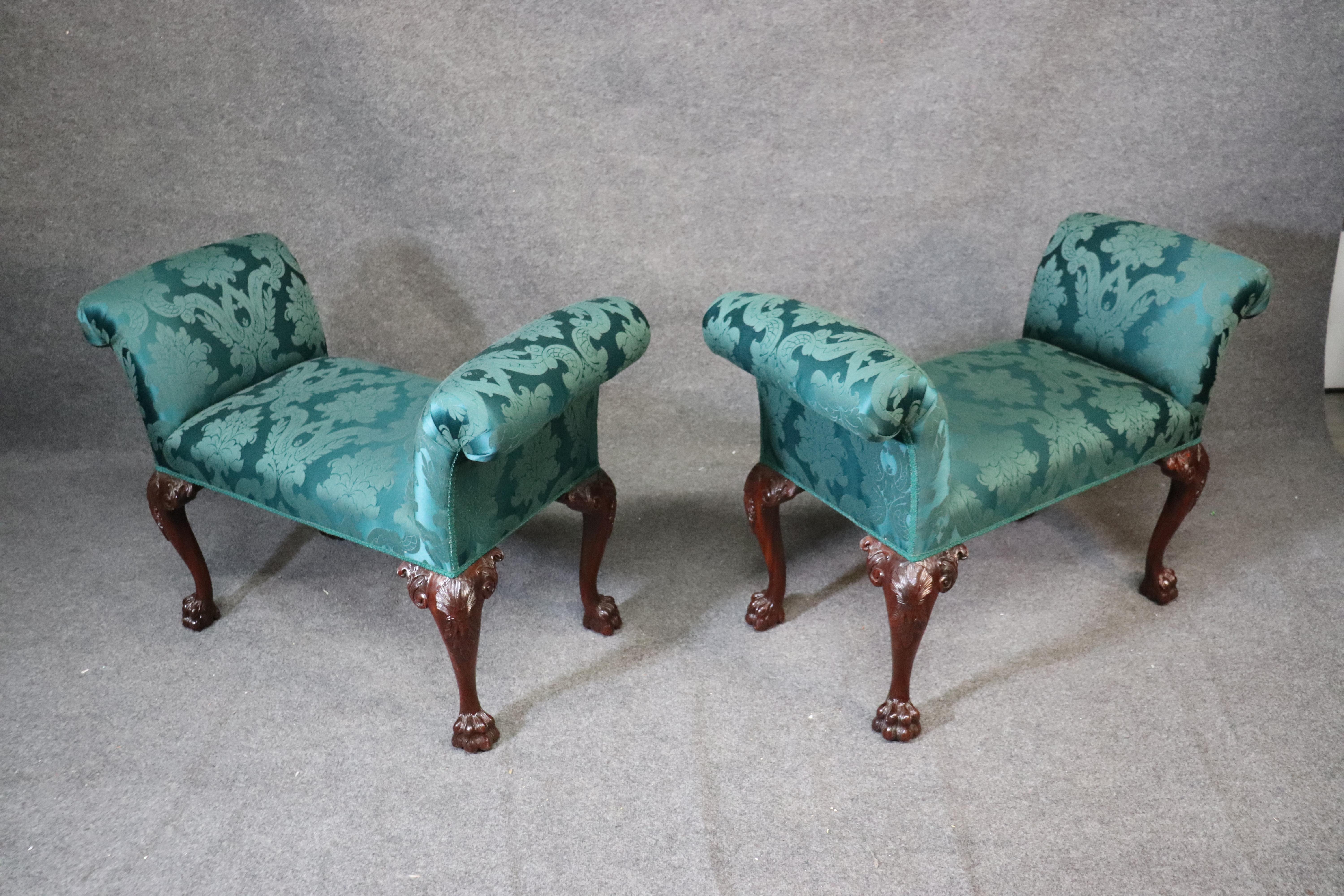 These stools are beautifully carved and feature beautiful green damask upholstery. They each measure: 29 tall x 41 wide x 17 deep. The seat height is 20 inches. They are from the 1960s era.