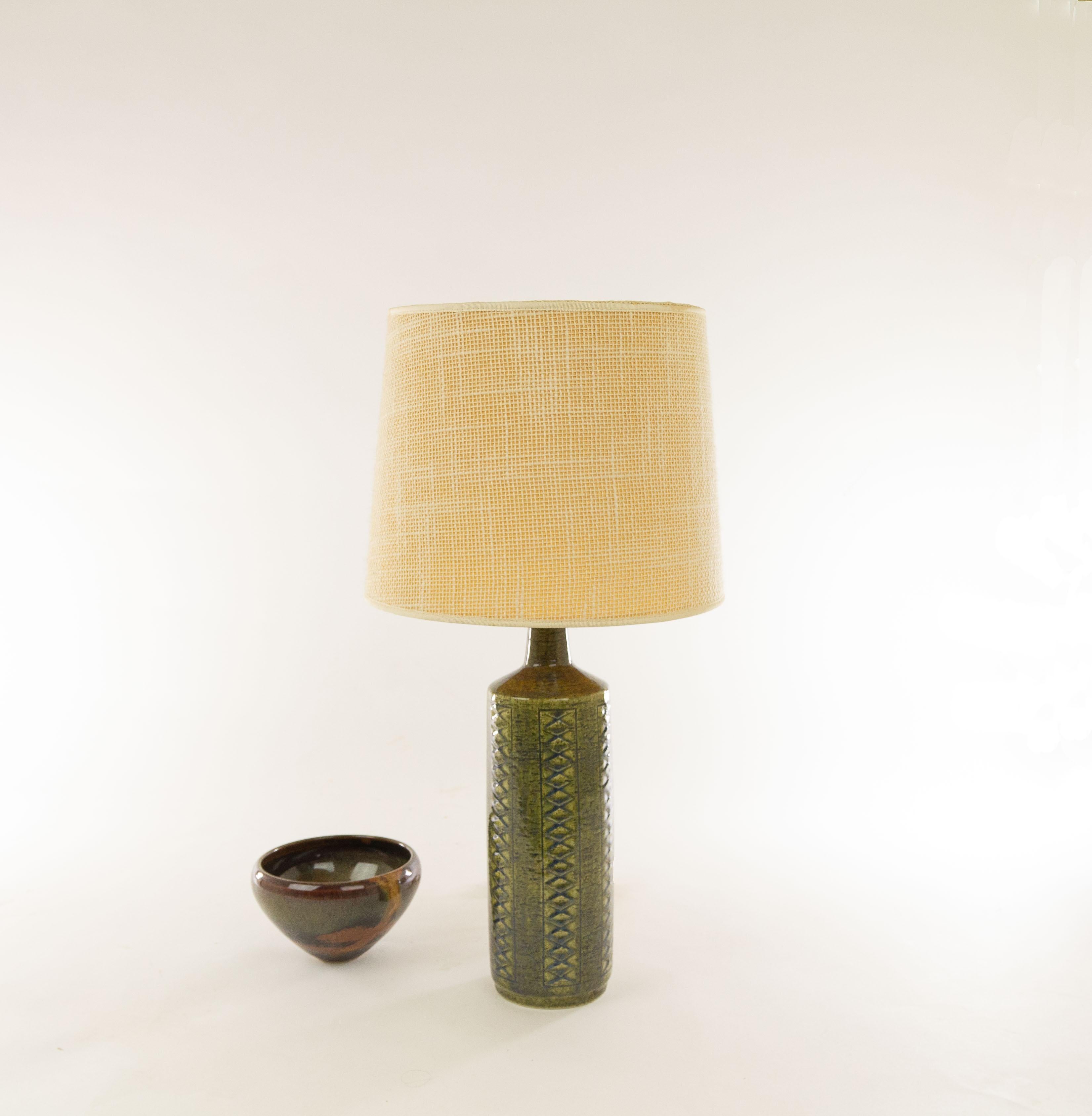 A pair of DL/27 table lamps made by Annelise and Per Linnemann-Schmidt for Palshus in the 1960s. The colour of one piece is olive green and the other piece is sage green with traces of Blue.

The lamps come with their original lampshade holders. The