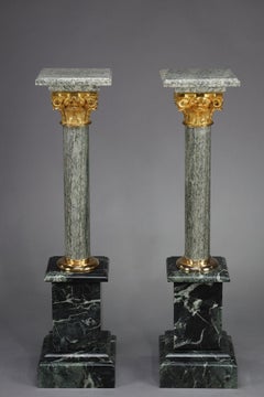 Pair of green Estours marble columns with Corinthian capitals