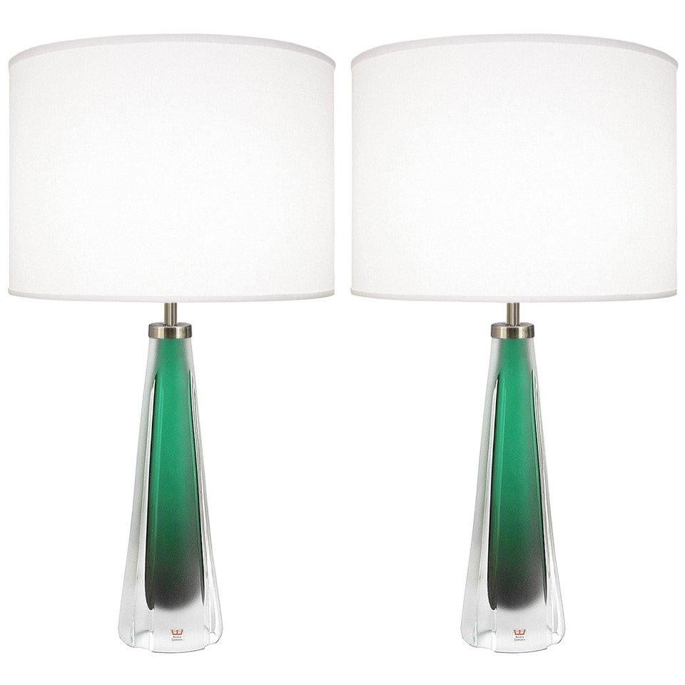 A pair of green glass lamps with thick frosted clear casing with nickel hardware by Kosta Boda.

Swedish, Circa 1960's

Lamp Shades Are Not Included.

If you are interested in Lamp Shades, please email The Craig Van Den Brulle Design Team Via