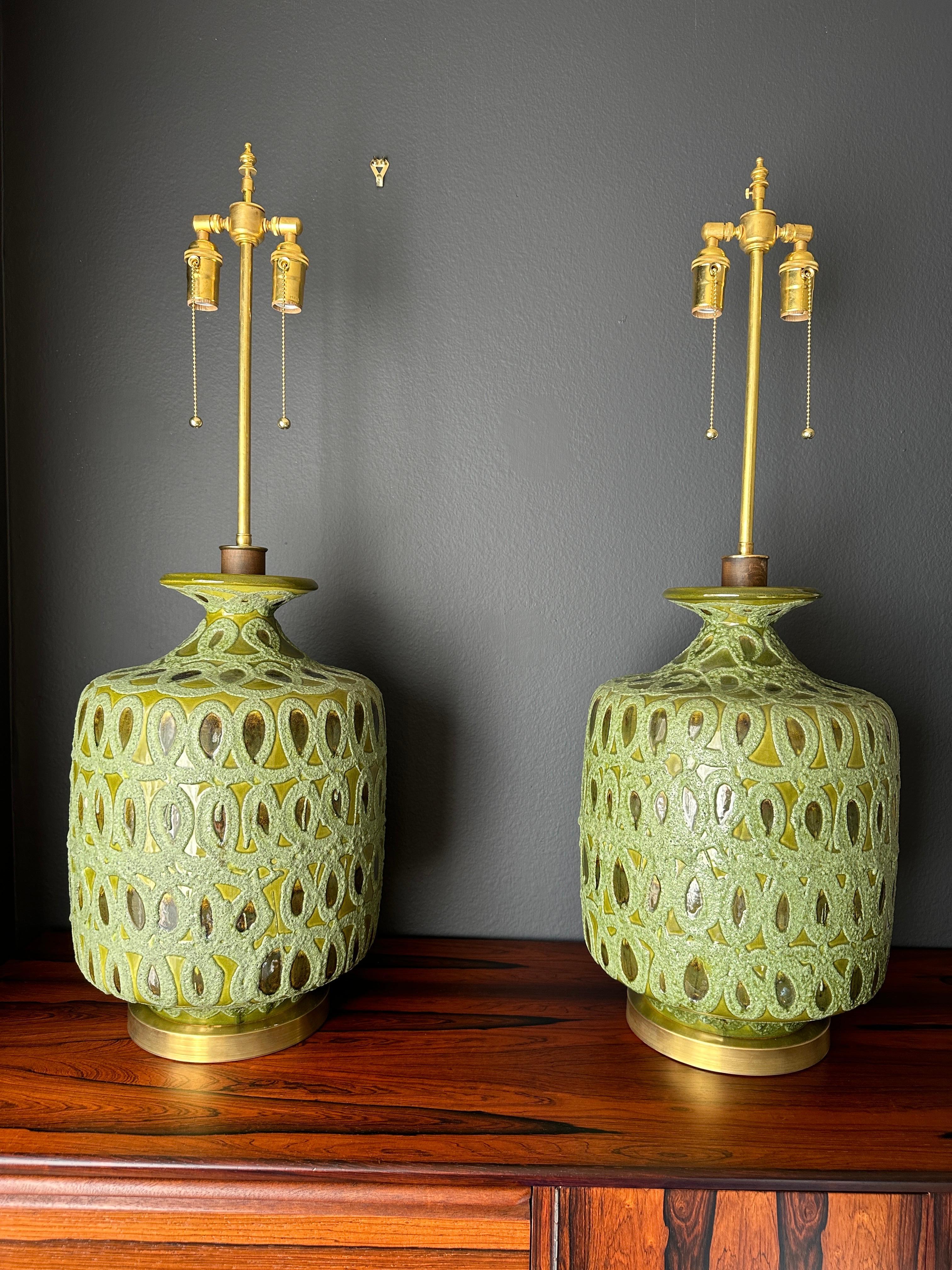 Pair of green glazed Mid-Century Modern ceramic lamps with brass bases. Requires two up to 60watt bulbs.