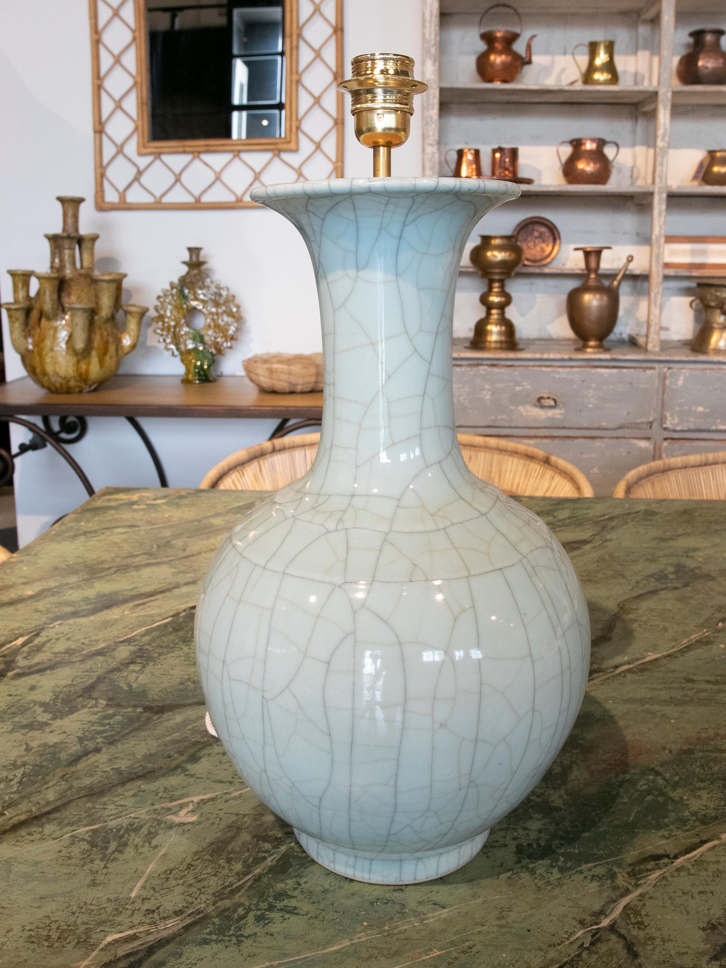 Pair of Green Glazed porcelain lamps with Crackled Finish.