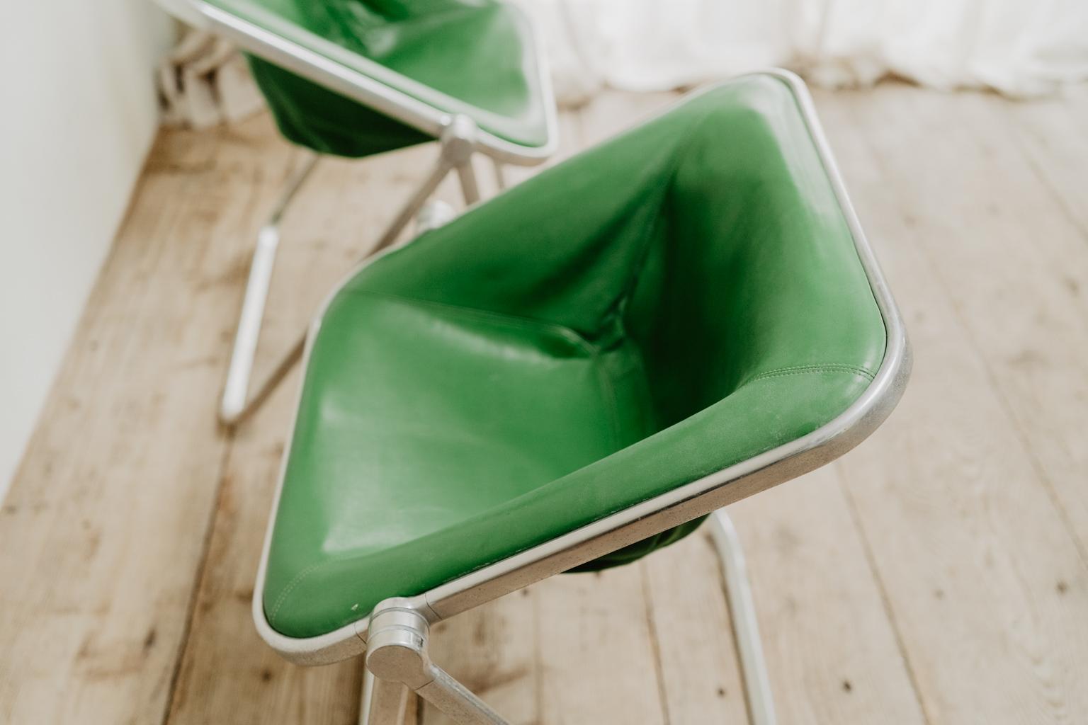 pair of green leather folding Plona chairs 3