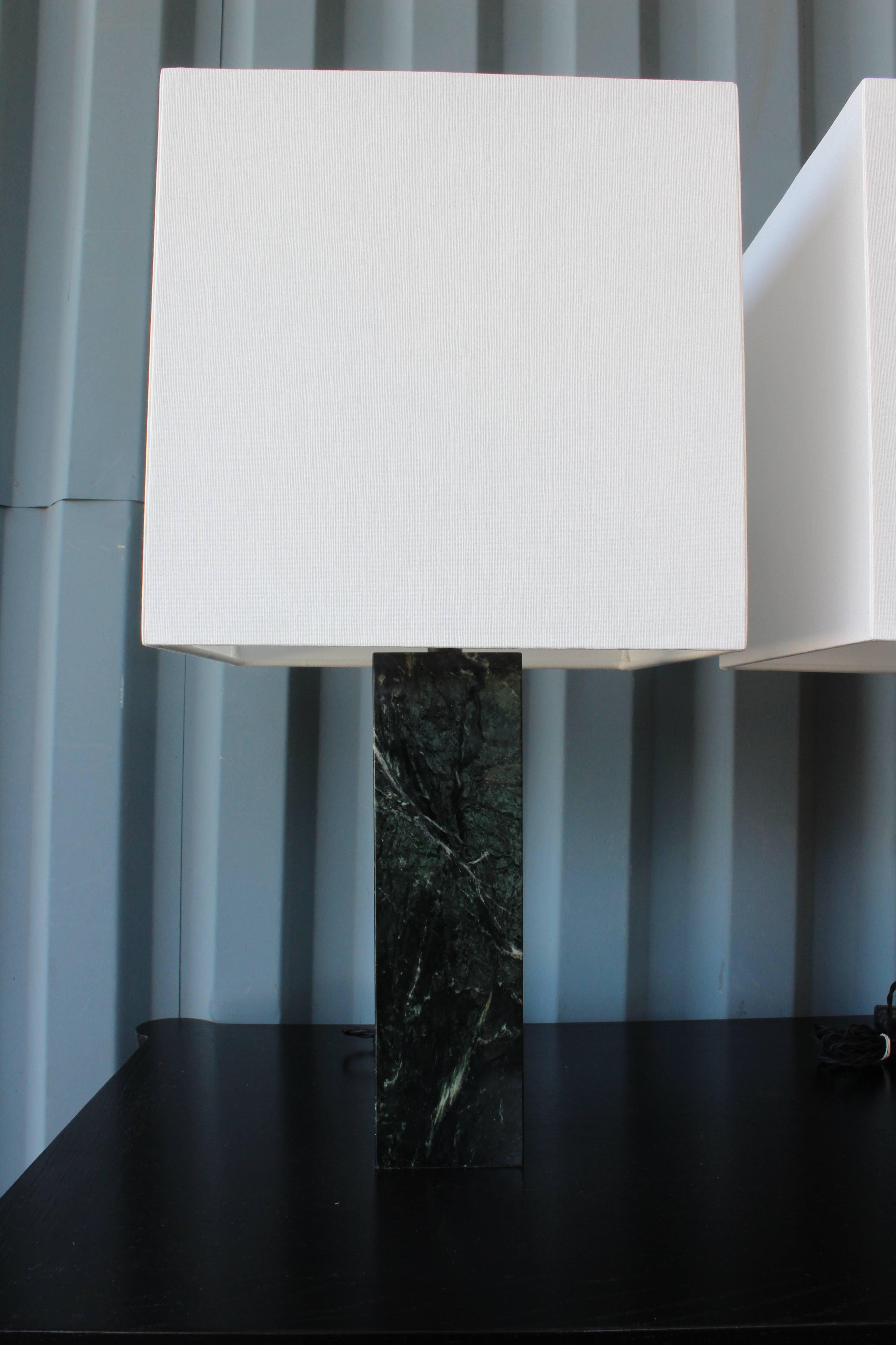 Pair of 1960s green marble lamps. Recently rewired and feature new custom-made shades in white linen.