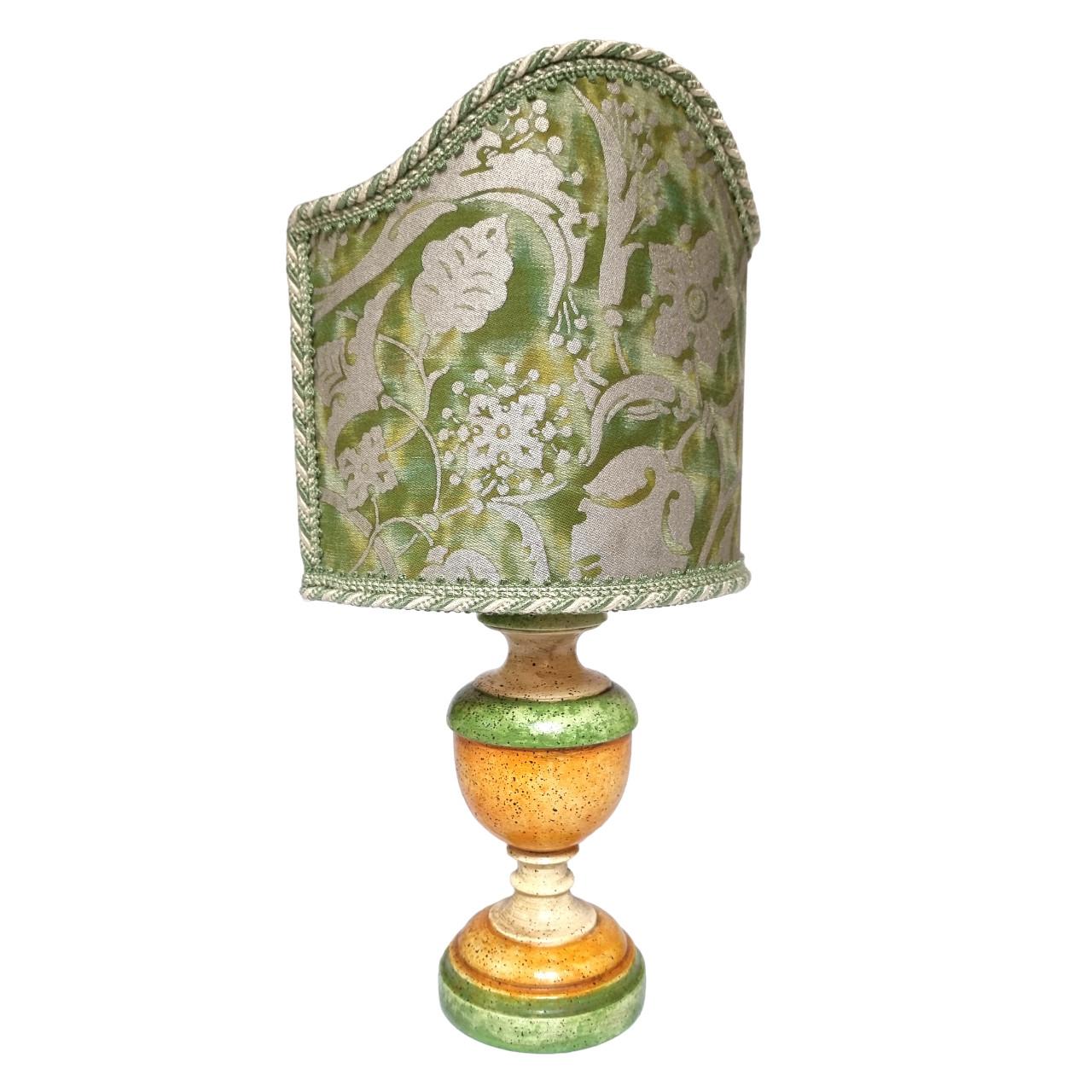 This is an absolutely fabulous pair of green, orange and ivory lacquered turned wood table lamps on a round base, handcrafted in Tuscany (Italy) and finished with antique patina.
The lampshade is new, handcrafted using Fortuny fabric Persepolis