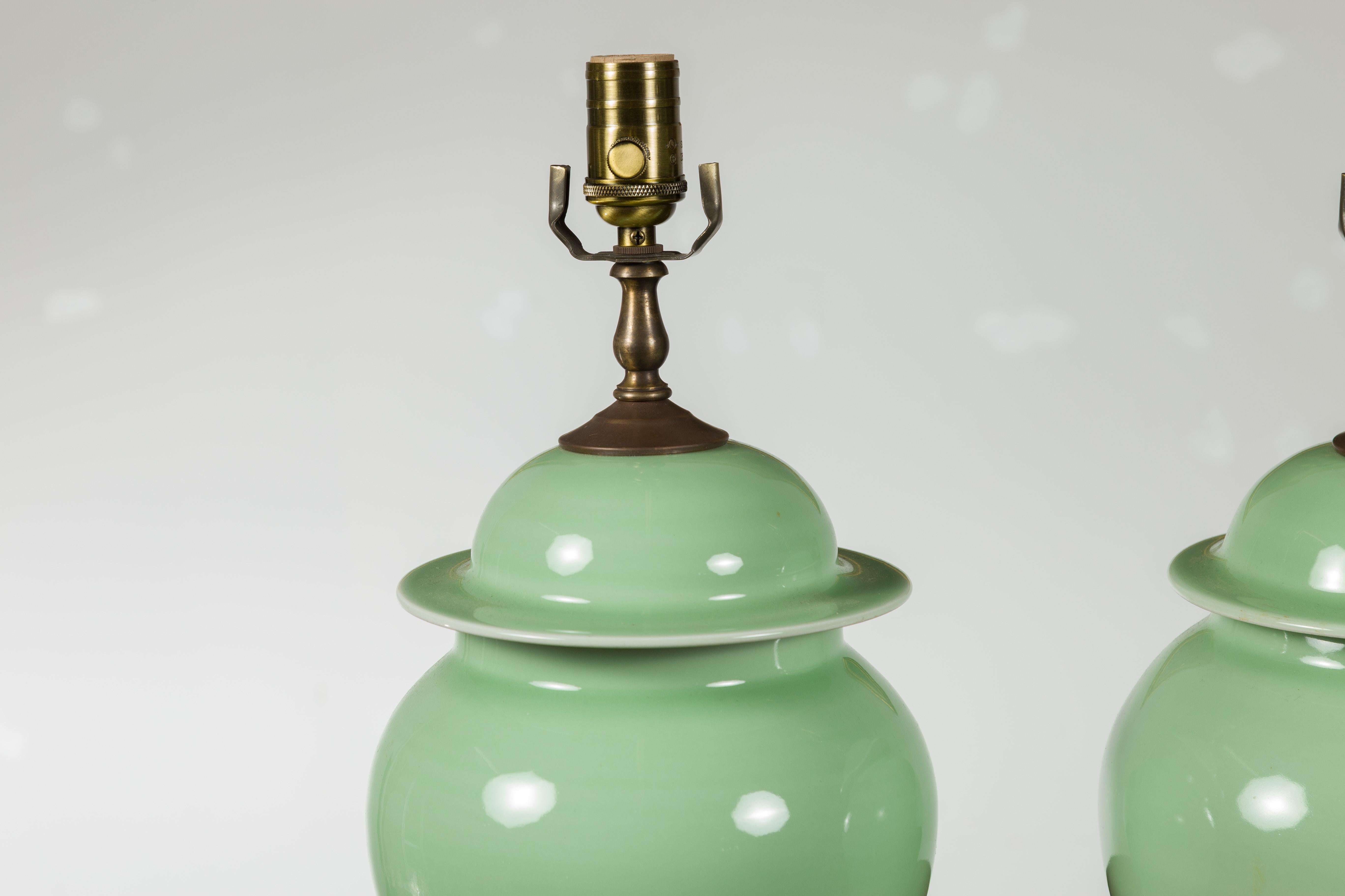 Pair of Green Porcelain Lidded Jar Table Lamps with Round Lucite Bases, Wired For Sale 3