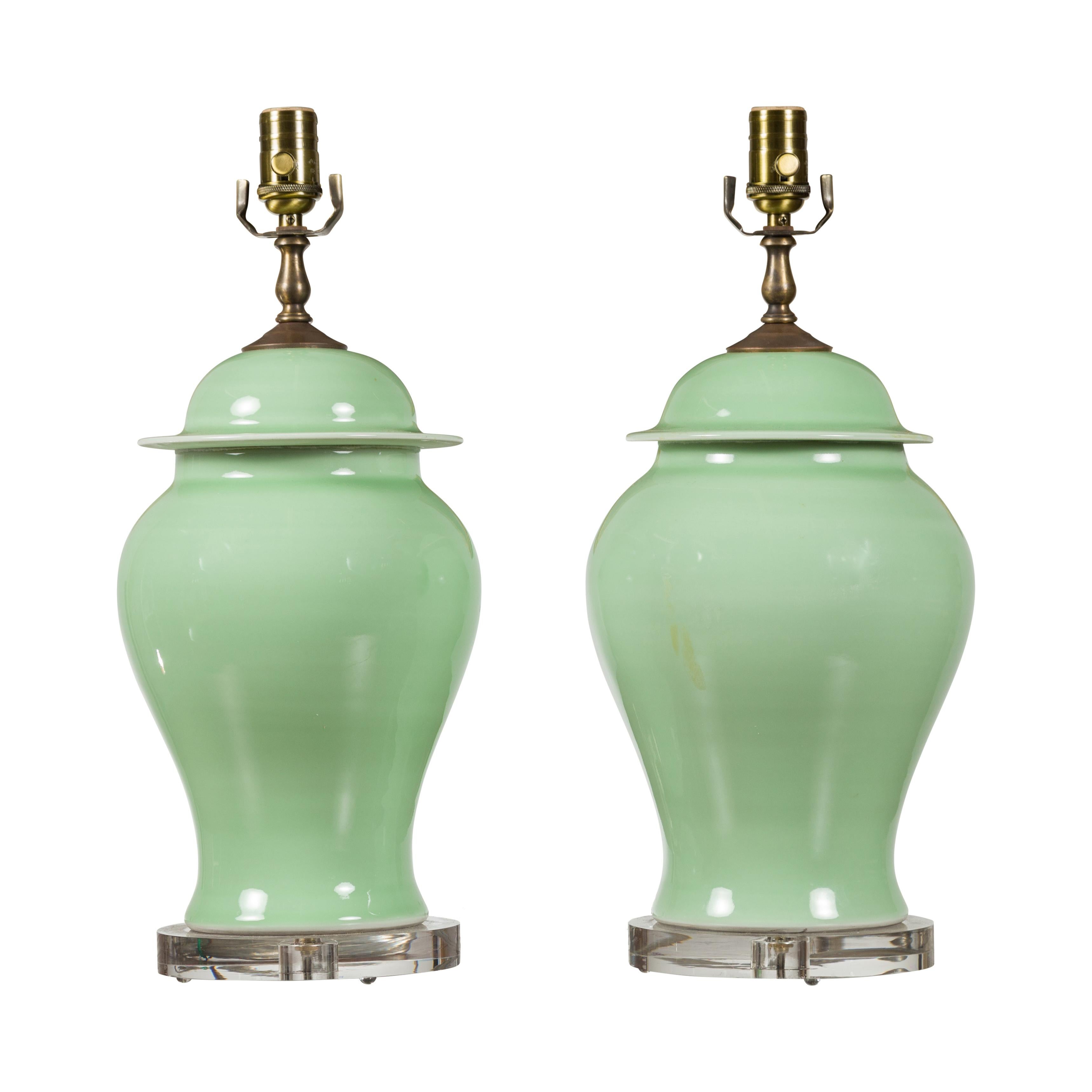 Pair of Green Porcelain Lidded Jar Table Lamps with Round Lucite Bases, Wired For Sale