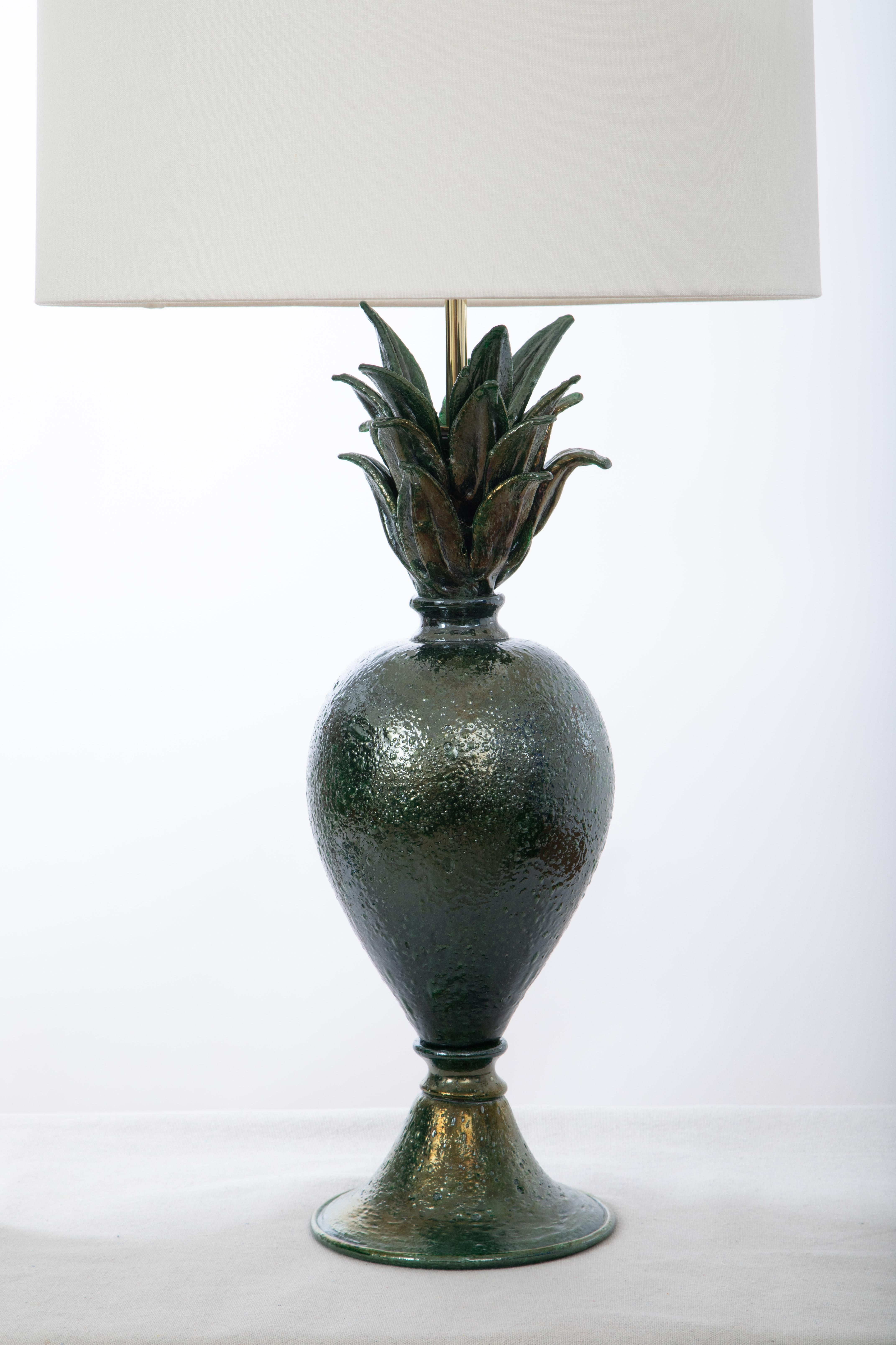 Pair of green Pulegoso Murano table lamps, in stock
Pineapple shape and beautiful dark green color and texture
This pair is one of kind, studio built
Shades not included
Wired to the American standard.

