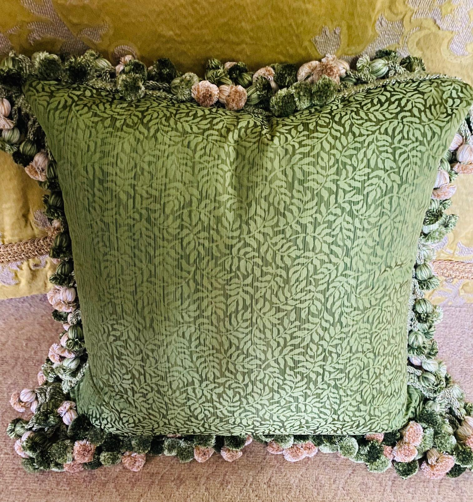 Pair of brilliant green silk down-filled cushions with onion-tassel fringe
Measures: 19