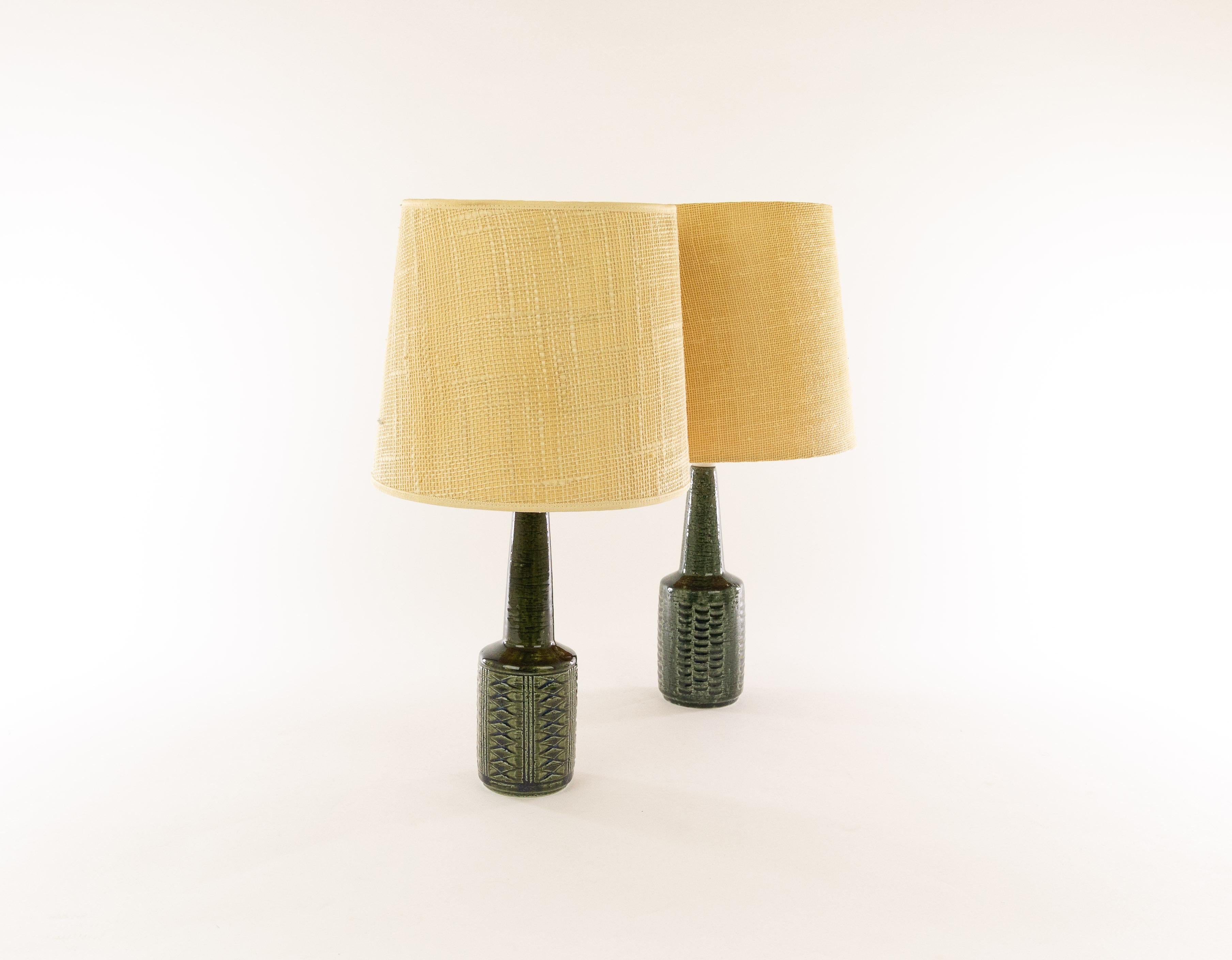 Two charming Danish chamotte (texture clay) table lamps model DL/21 with impressed decoration by Annelise and Per Linnemann-Schmidt for Palshus, Denmark, 1960s.

Palshus produced a wide range of table lamps, in different patterns, height and