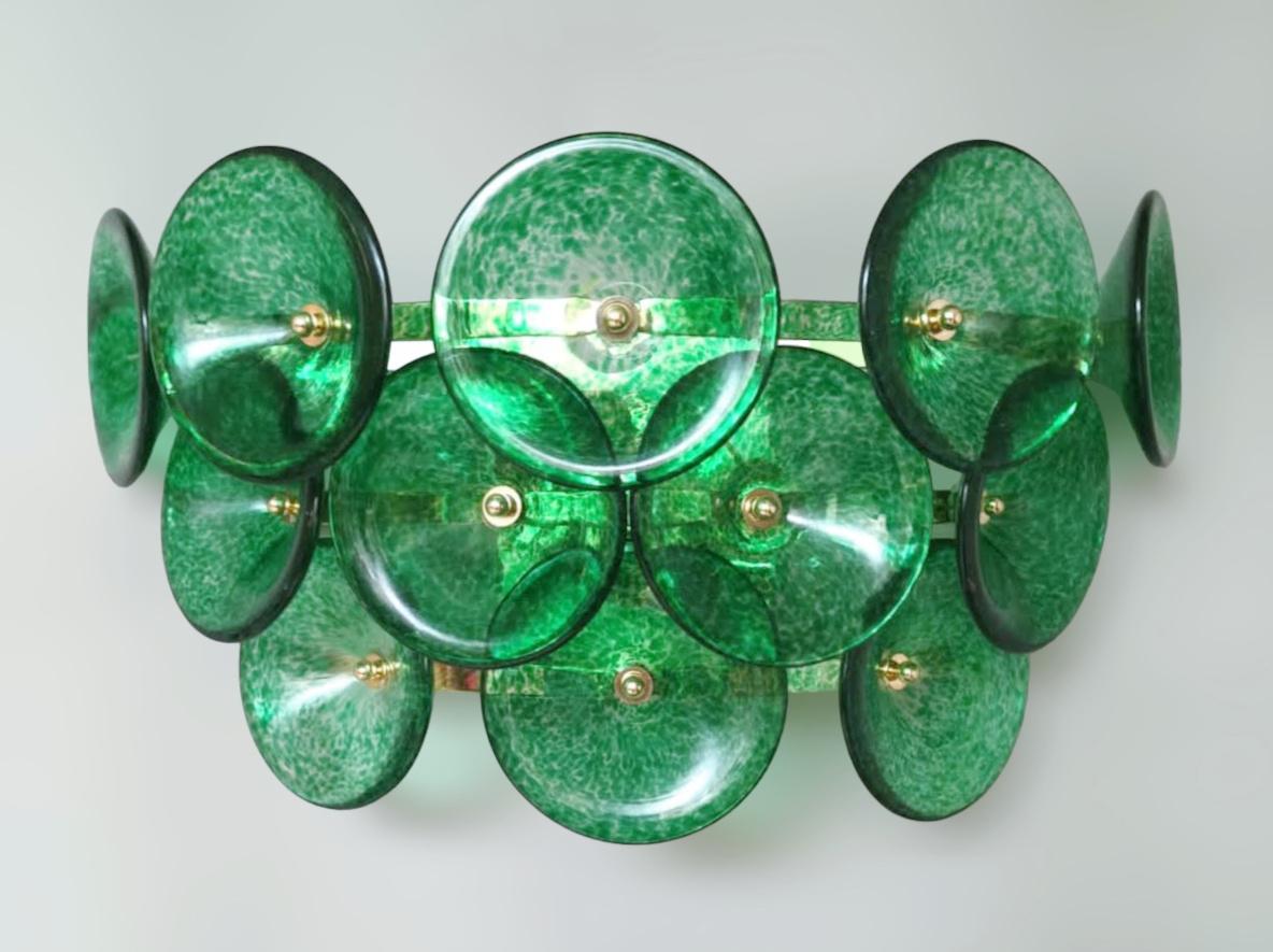 Italian wall lights with green Murano glass trumpets mounted on gold metal frames / Made in Italy in the style of Vistosi, 1970s
2 lights / E12 or E14 type / max 40W each
Measures: Height 10 inches, width 20.5 inches, depth 7.5 inches
1 pair