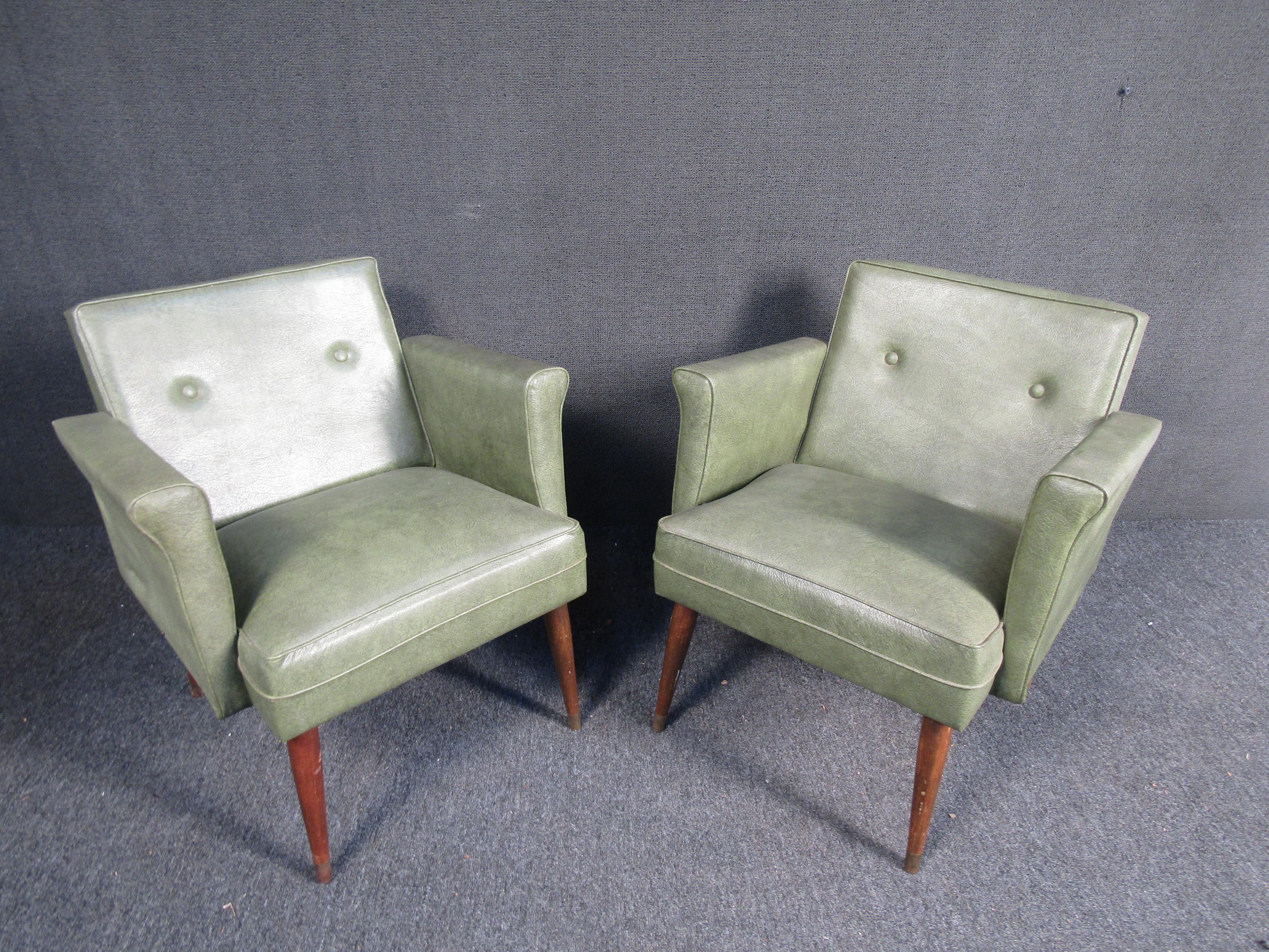 Unique pair of Mid-Century Modern style green leather chairs. 
(Please confirm item location - NY or NJ - with dealer).
    
