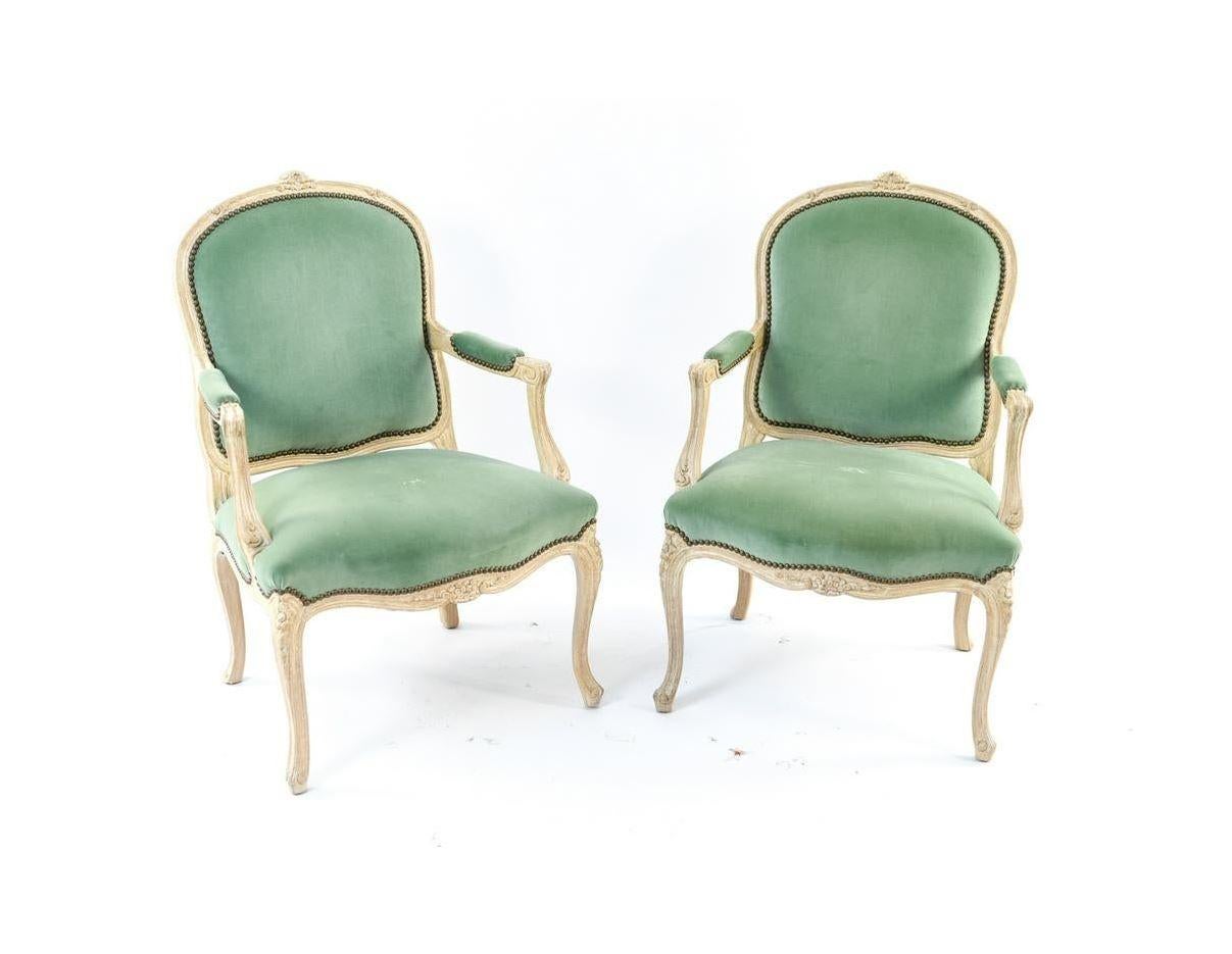 Pair of light green velvet Louis XV style fauteuils arm chairs.
