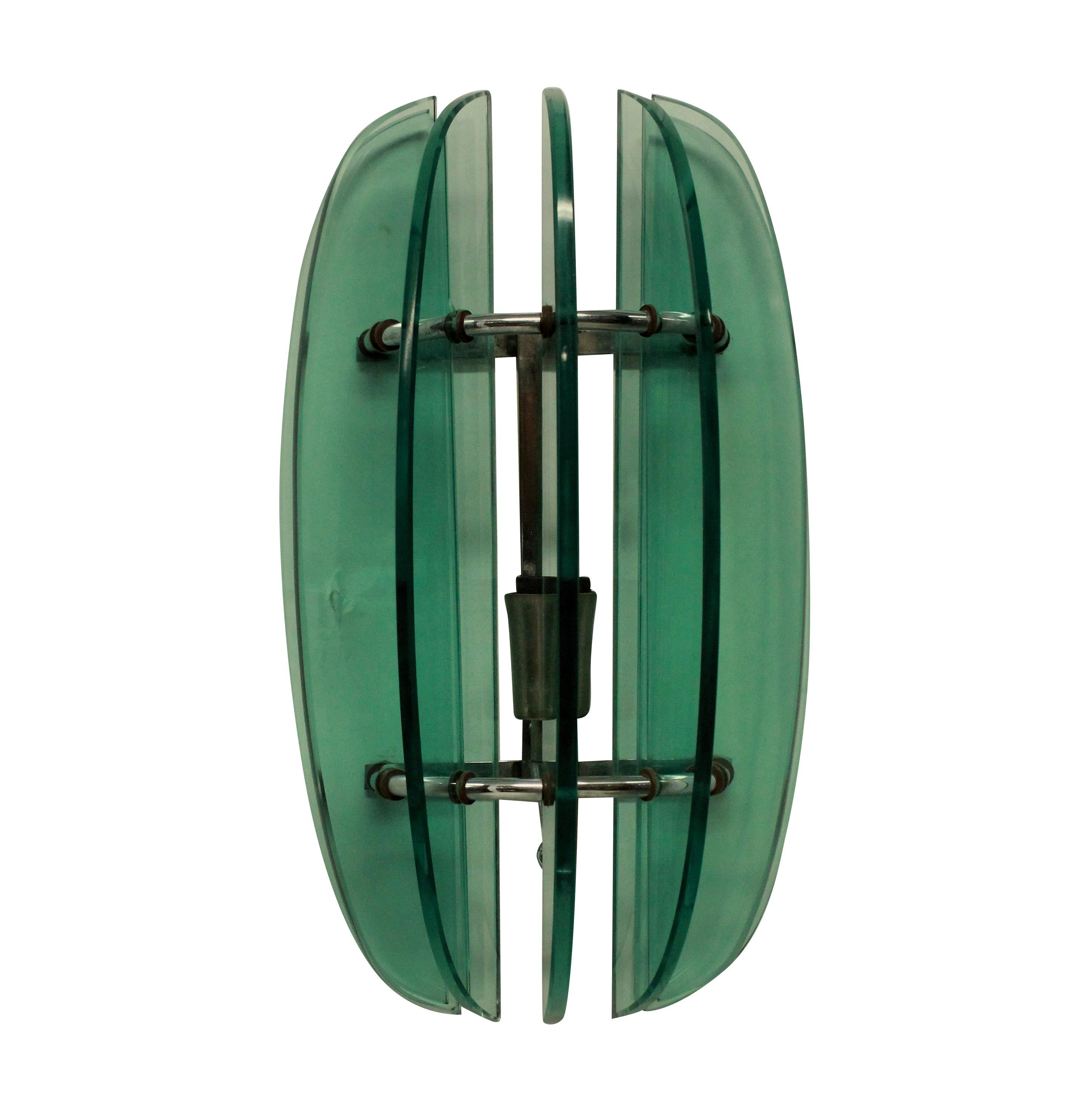 A pair of Italian midcentury green glass wall lights by Veca.