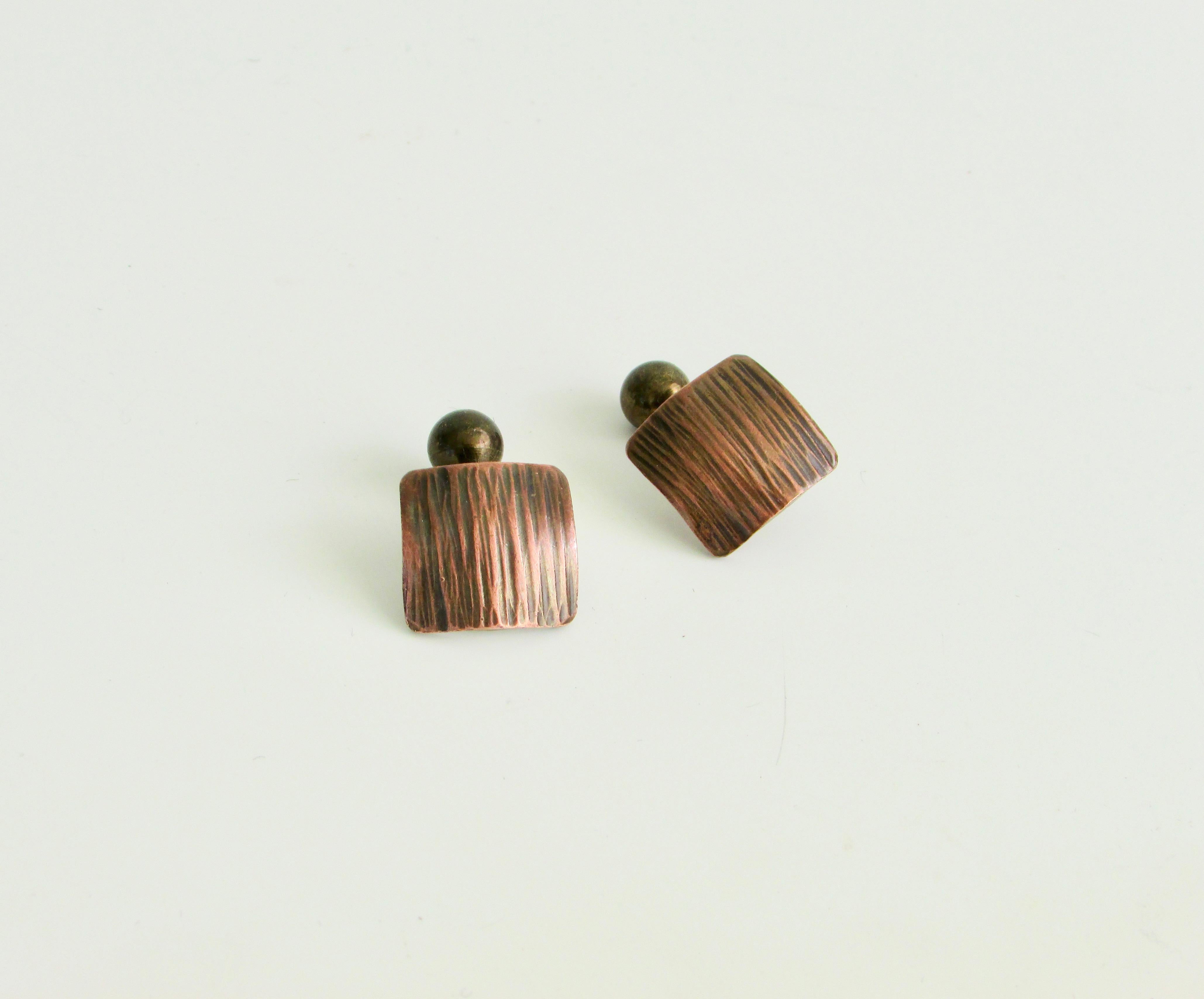 Nicely crafted pair of cuff links by and signed Rebaje . Hammered copper face with brass button on backside . 
Francisco Torres arrived in NY from Dominican Republic in 1922. Sleeping on couches and in basements of friends trying to make his fortune